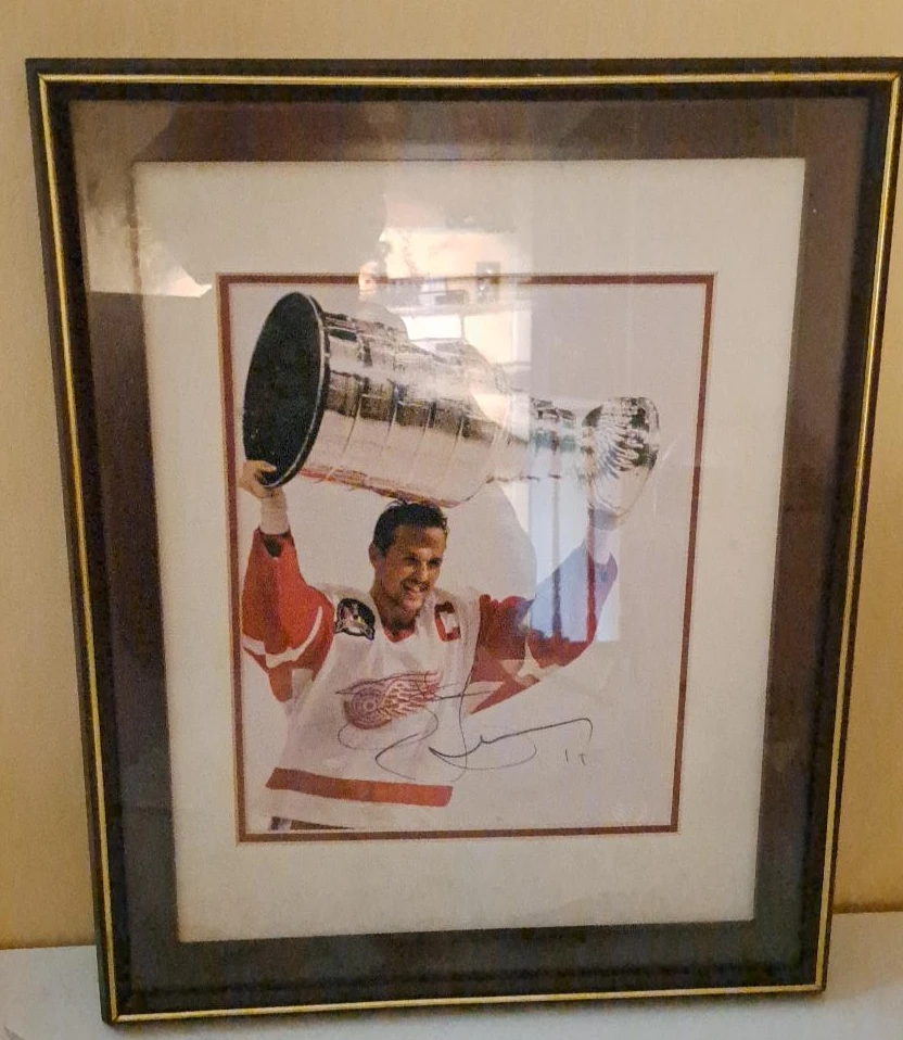 Framed Autographed Picture of Hockey Player with Stanley Cup
