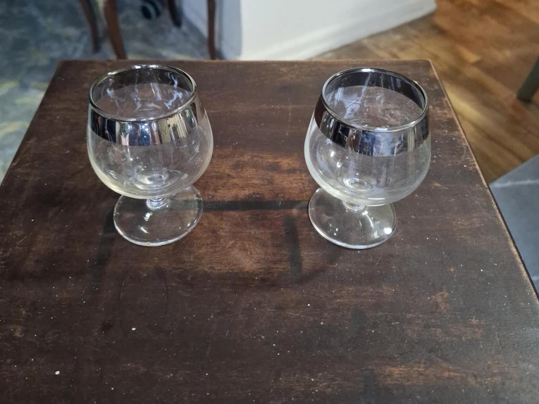 Two Silver Rimmed Brandy Glasses