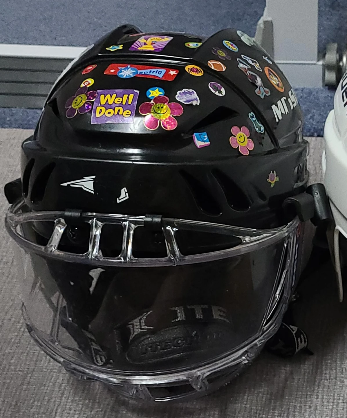 Black Bauer Hockey Helmet with Stickers