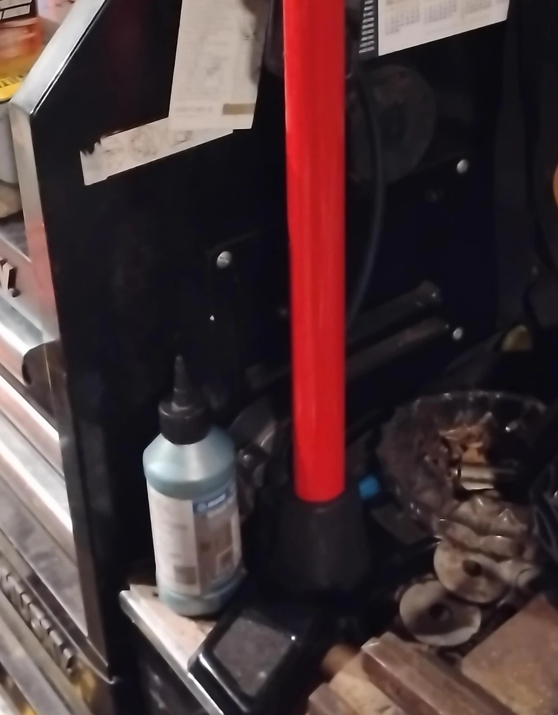 Blue Ink Bottle with Red Handle Tool