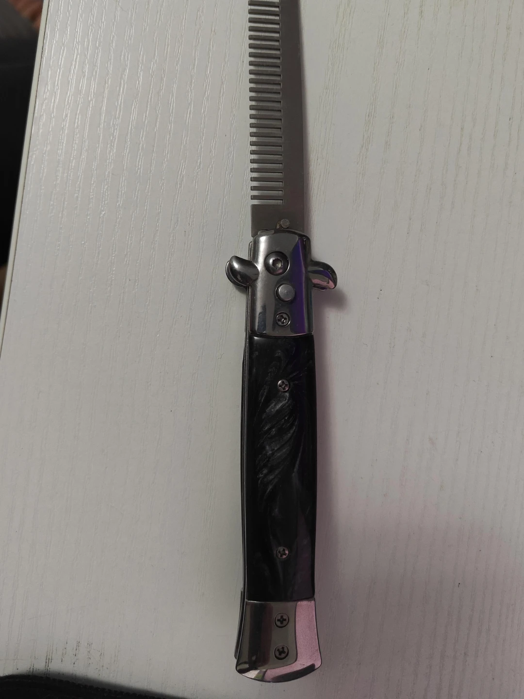 Switchblade Style Comb