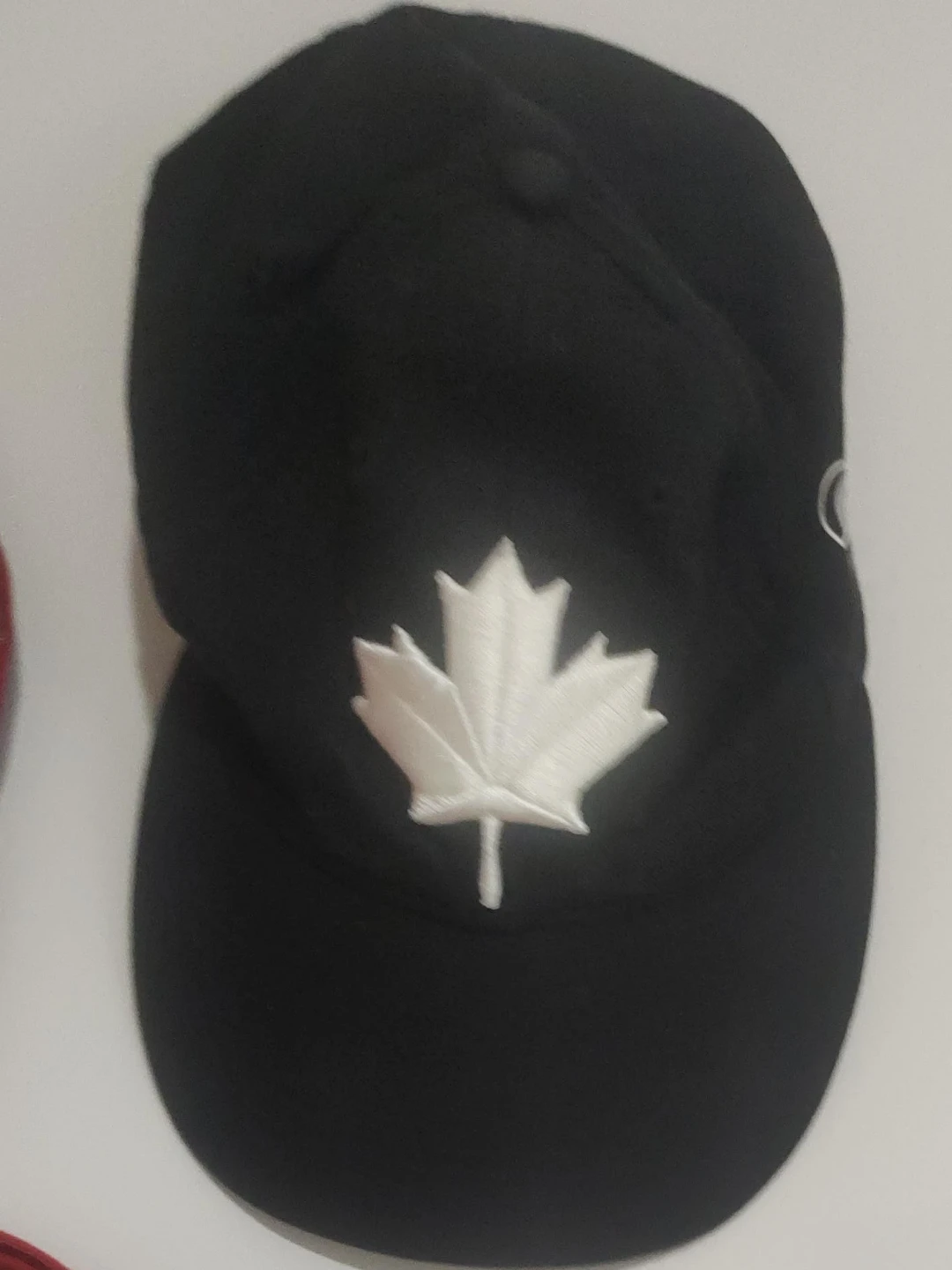 Black Baseball Cap with White Embroidered Maple Leaf