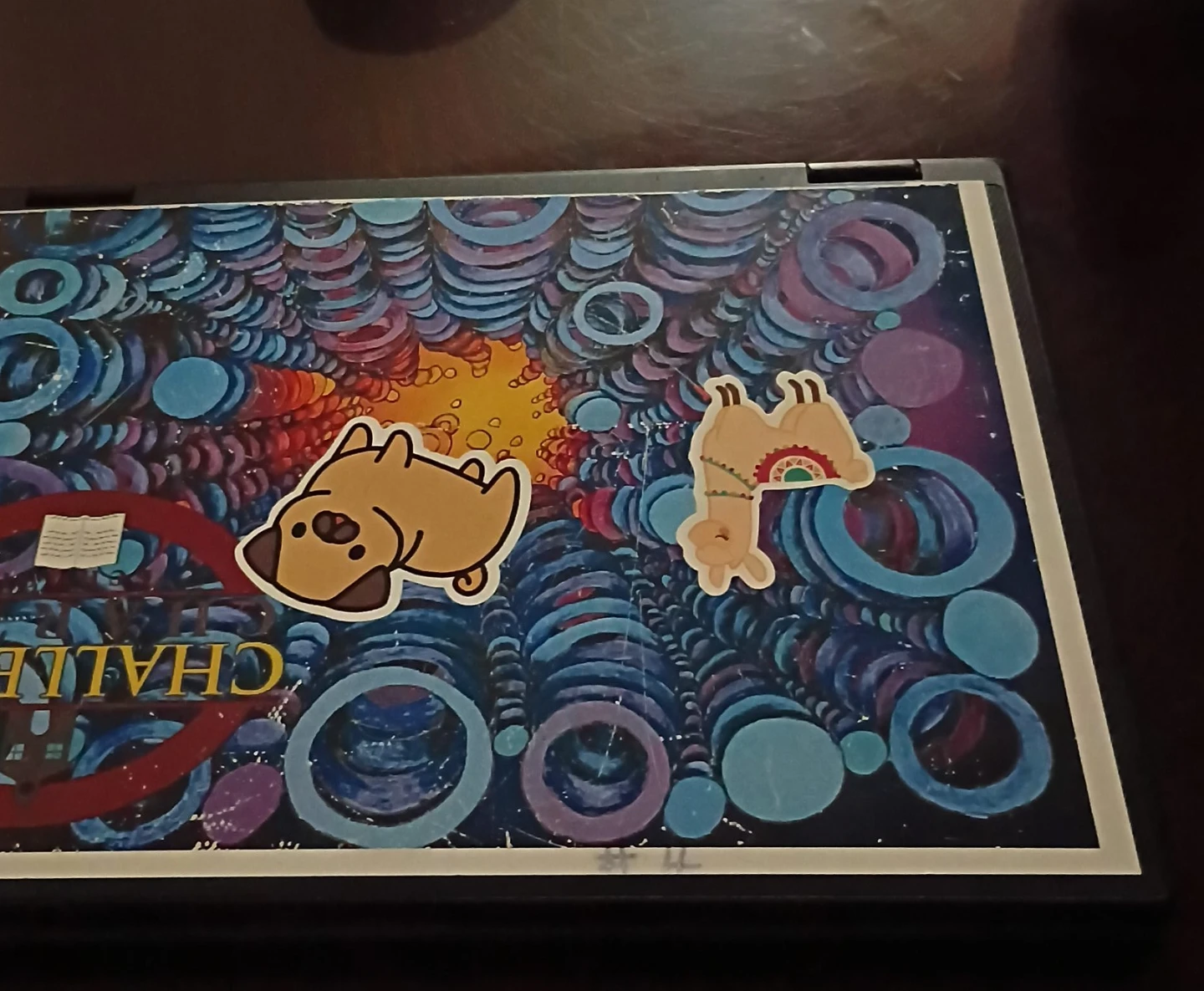 Laptop with Pug and Llama Stickers