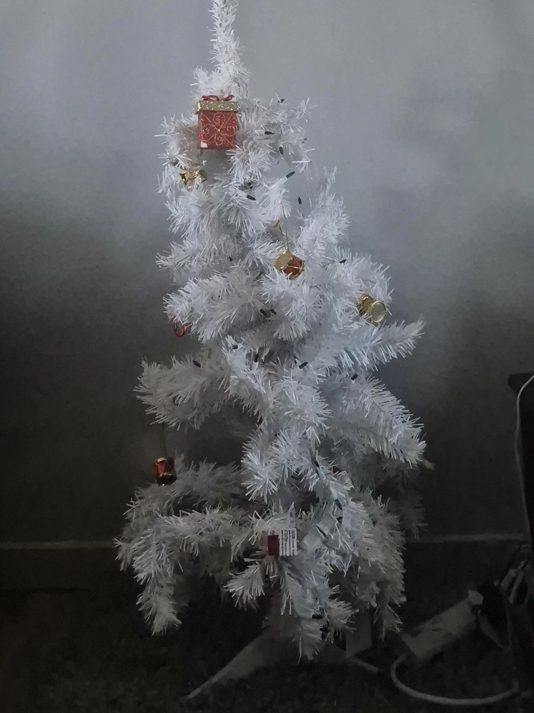 White artificial Christmas tree with ornaments