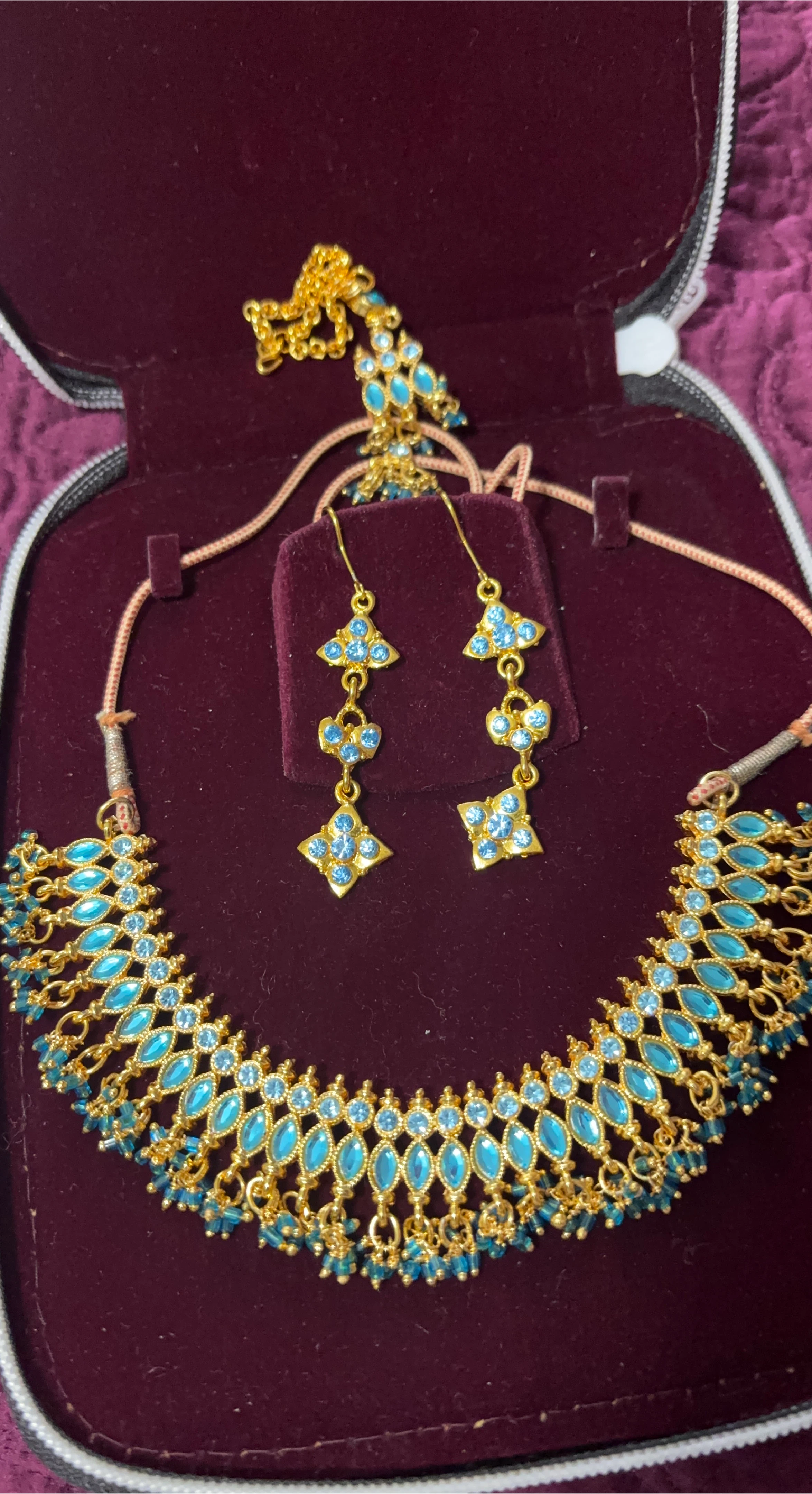 Gold-tone necklace and earring set with blue stones