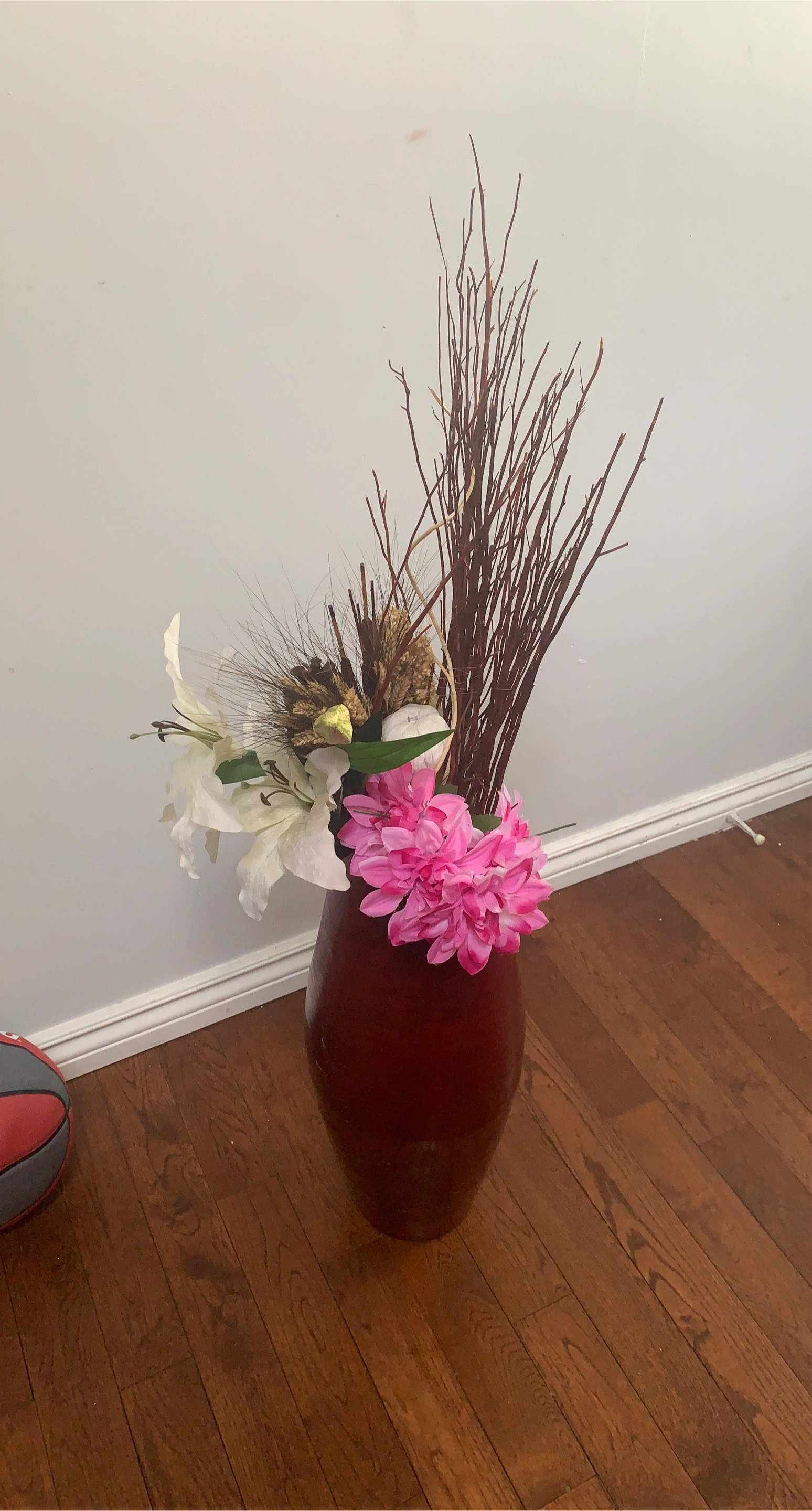 Large Red Vase with Floral and Twig Arrangement