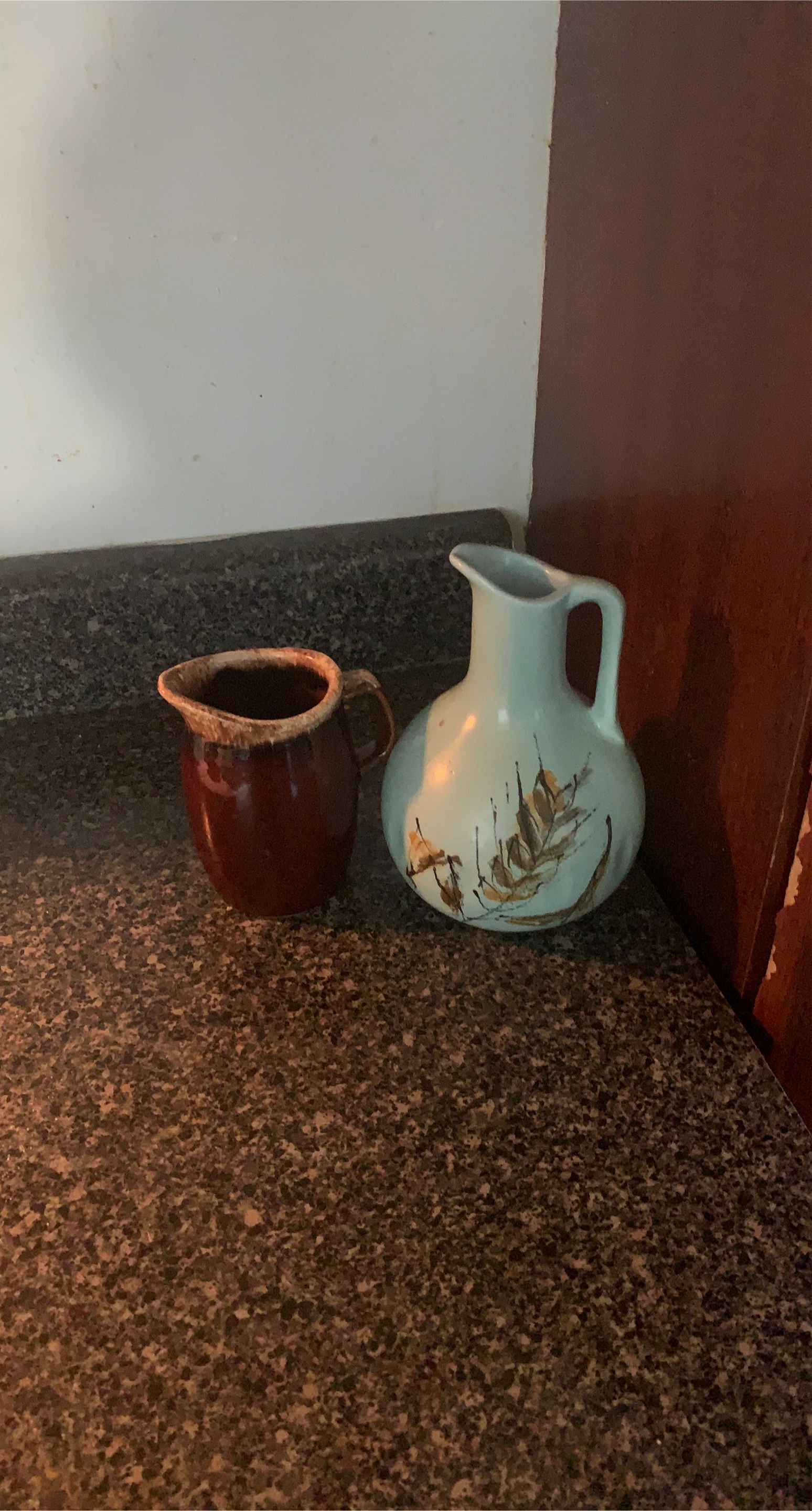 Brown creamer jug and blue floral pitcher