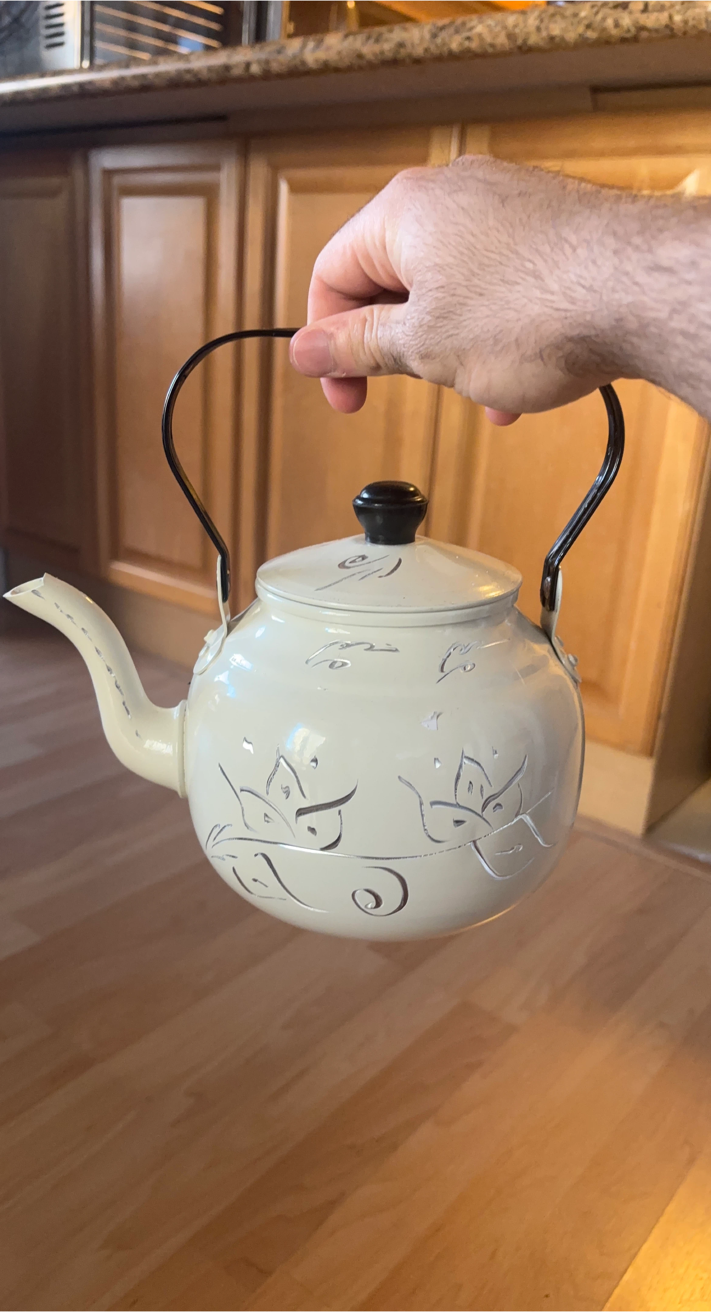 Cream coloured decorative teapot
