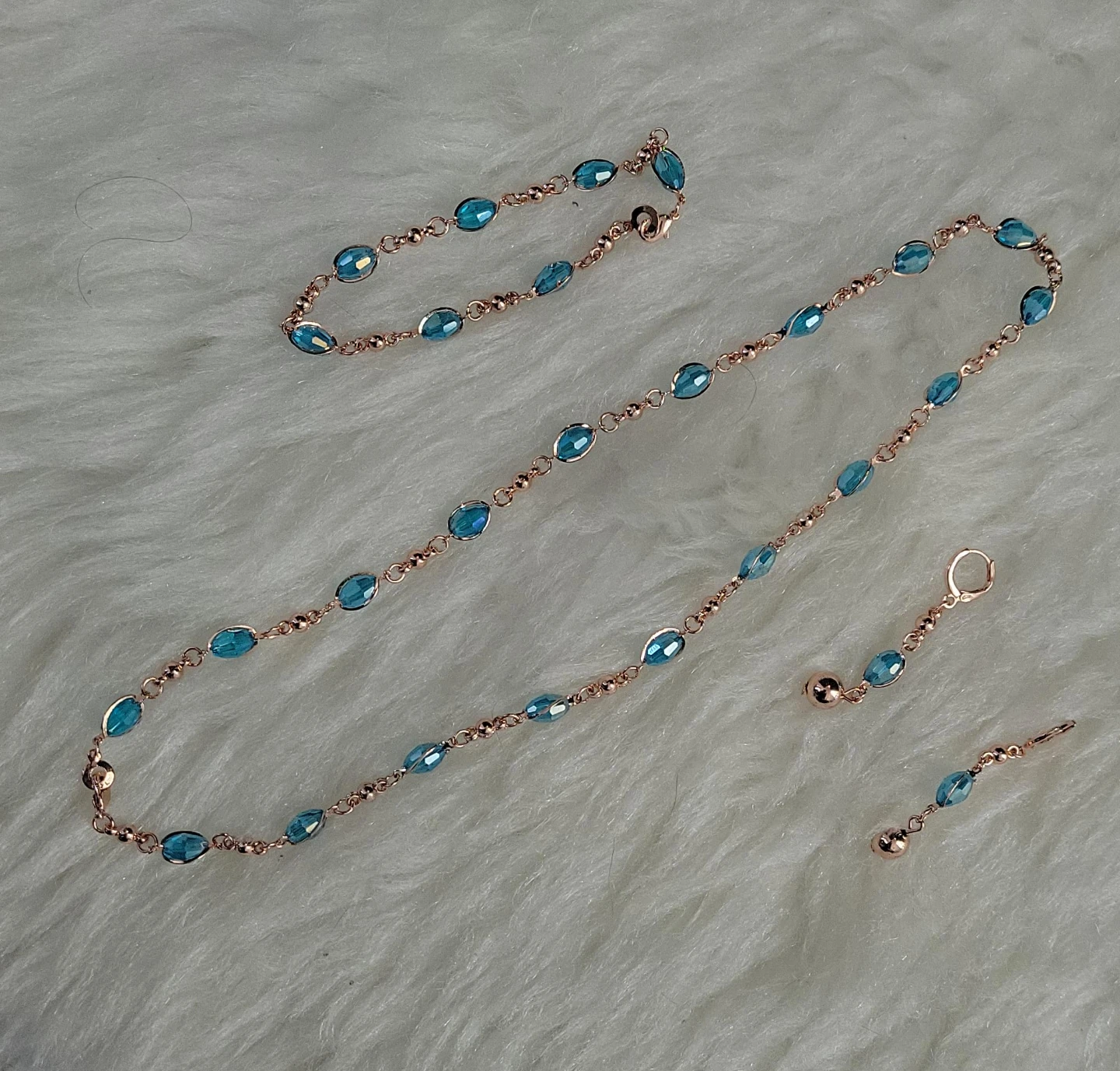 Rose Gold Tone Necklace, Bracelet, Earrings with Blue Crystals