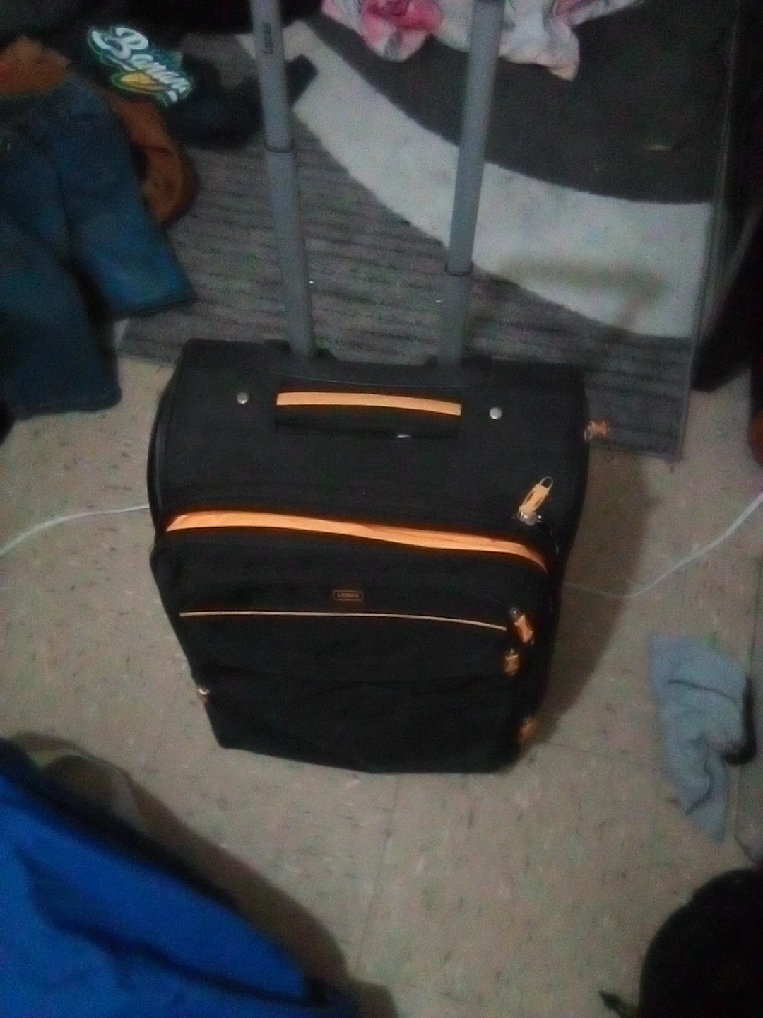 Black Rolling Suitcase with Orange Accents