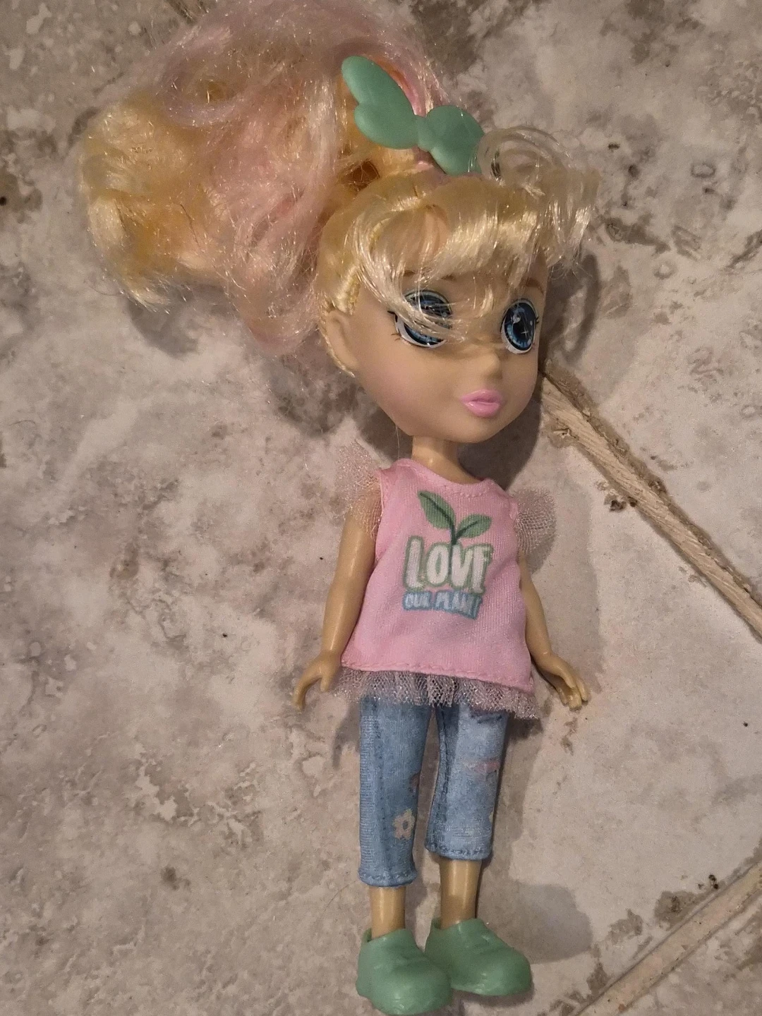Doll with pink shirt and blue jeans