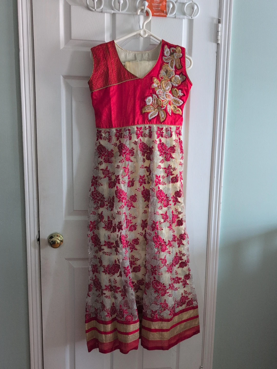 Women's embroidered pink and cream Indian dress