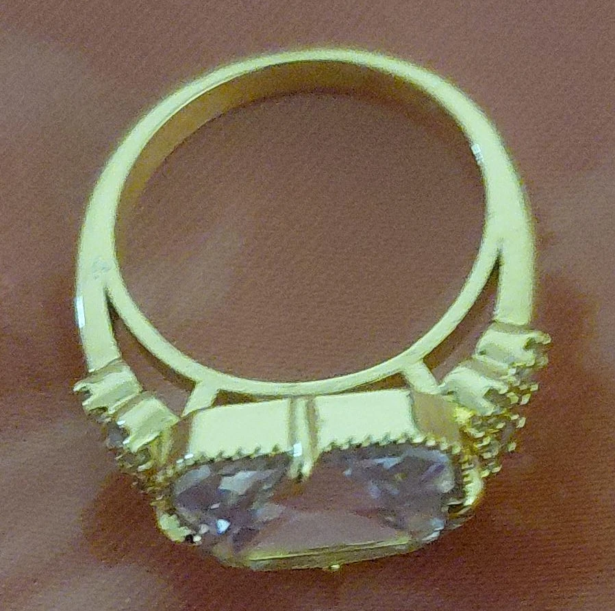 Gold coloured ring with clear stone