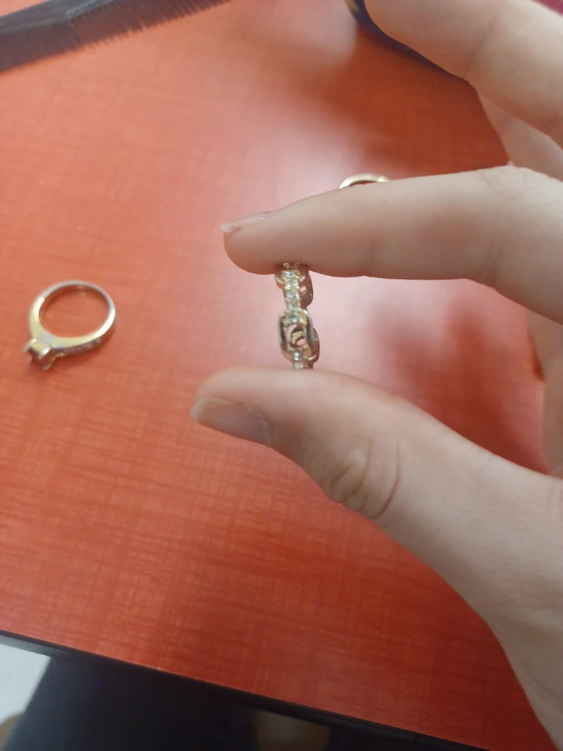 Gold tone ring with clear stones