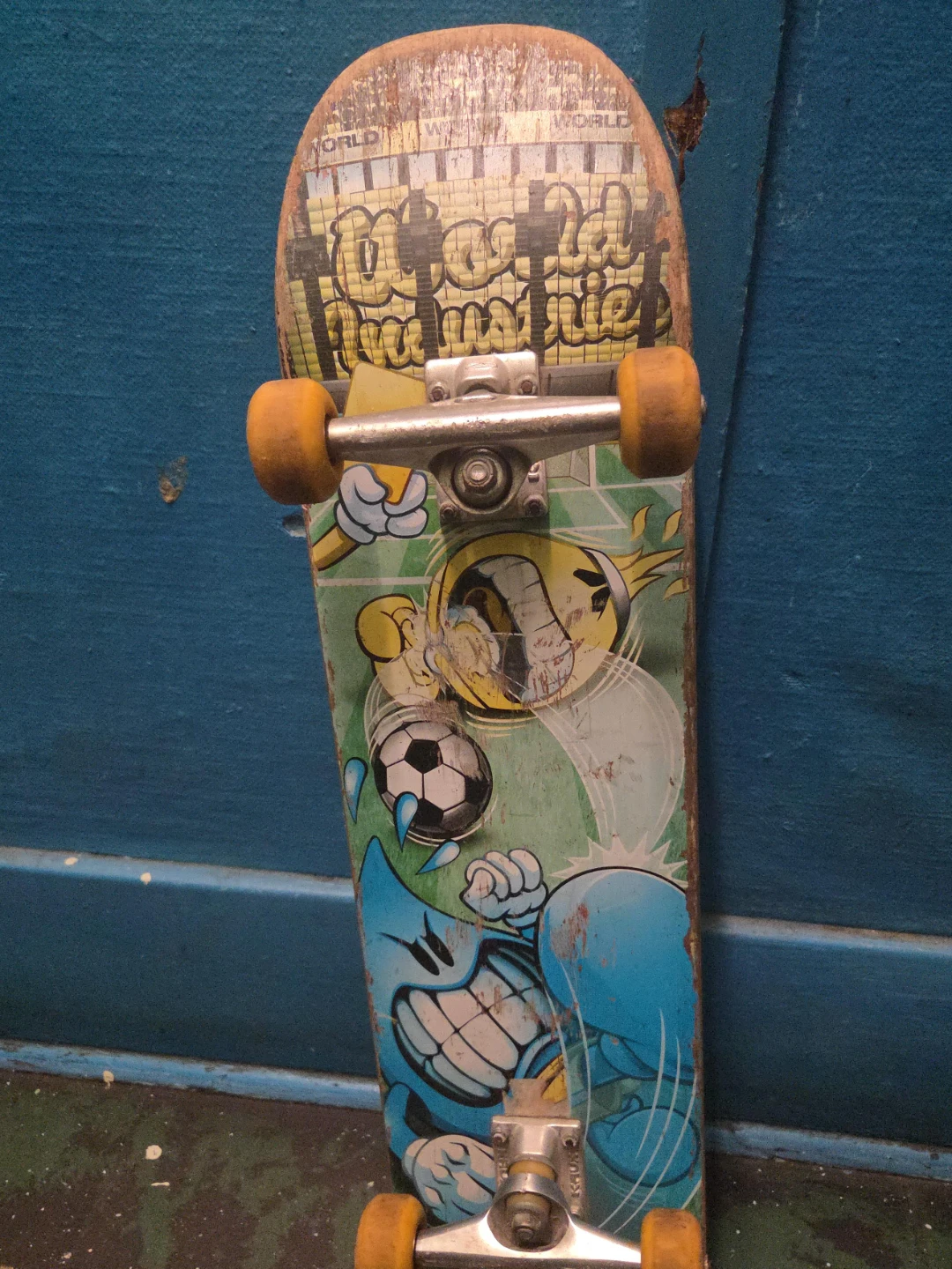 Used Skateboard with Cartoon Graphics
