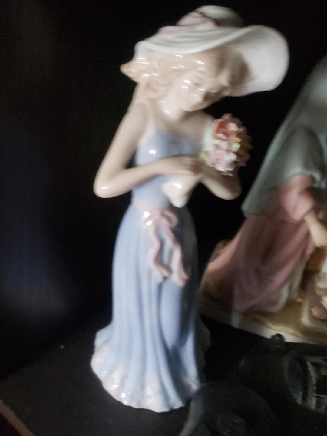 Porcelain Figurine of a Woman with a Hat