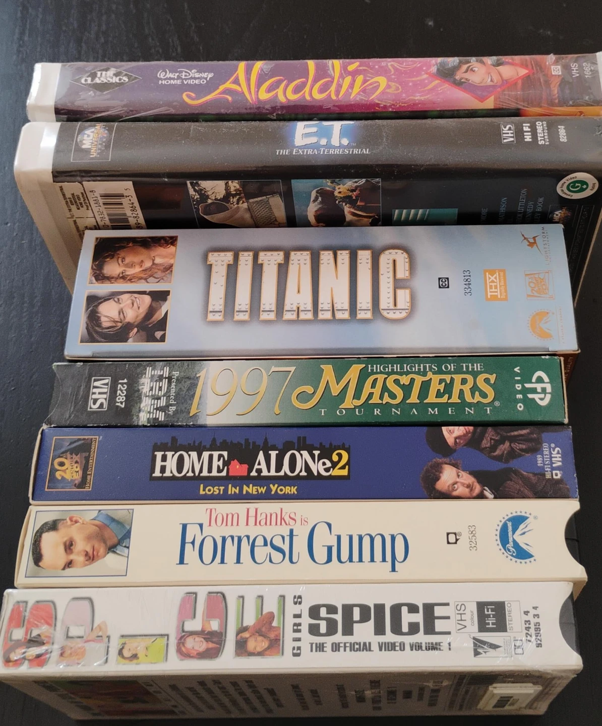 Collection of 7 VHS Movies: Aladdin, E.T., Titanic, and more