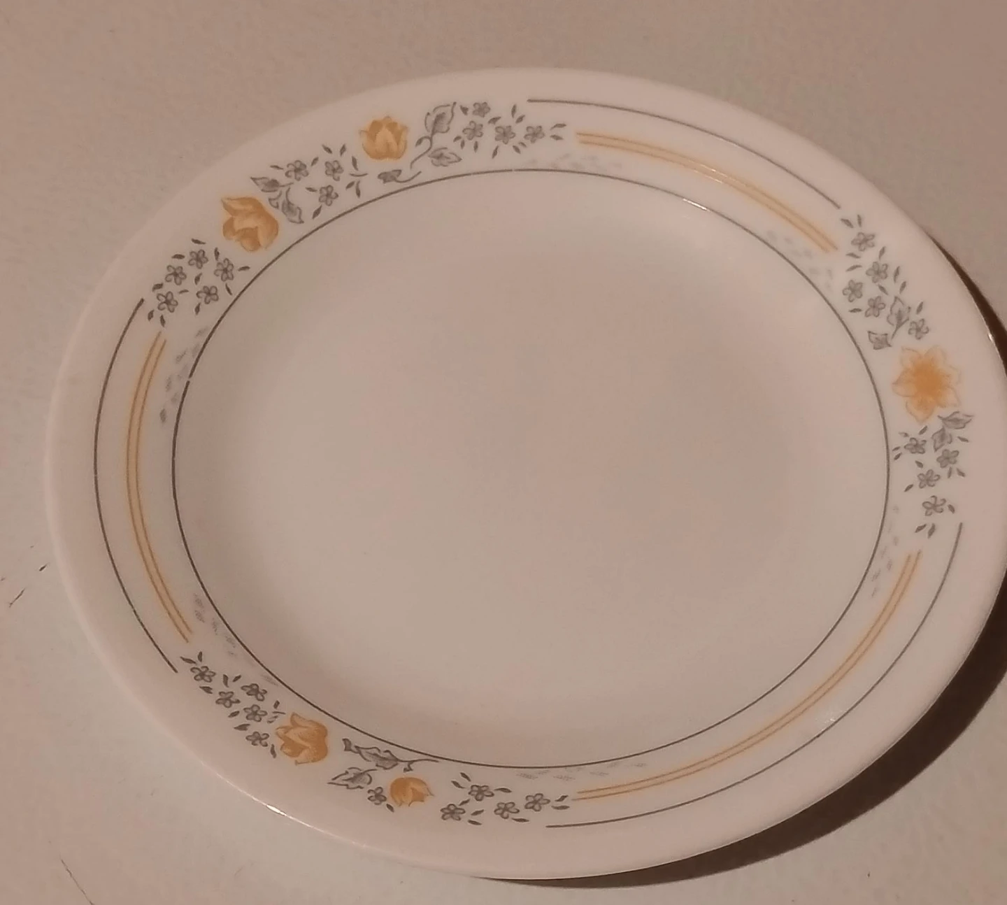 White dinner plate with floral pattern