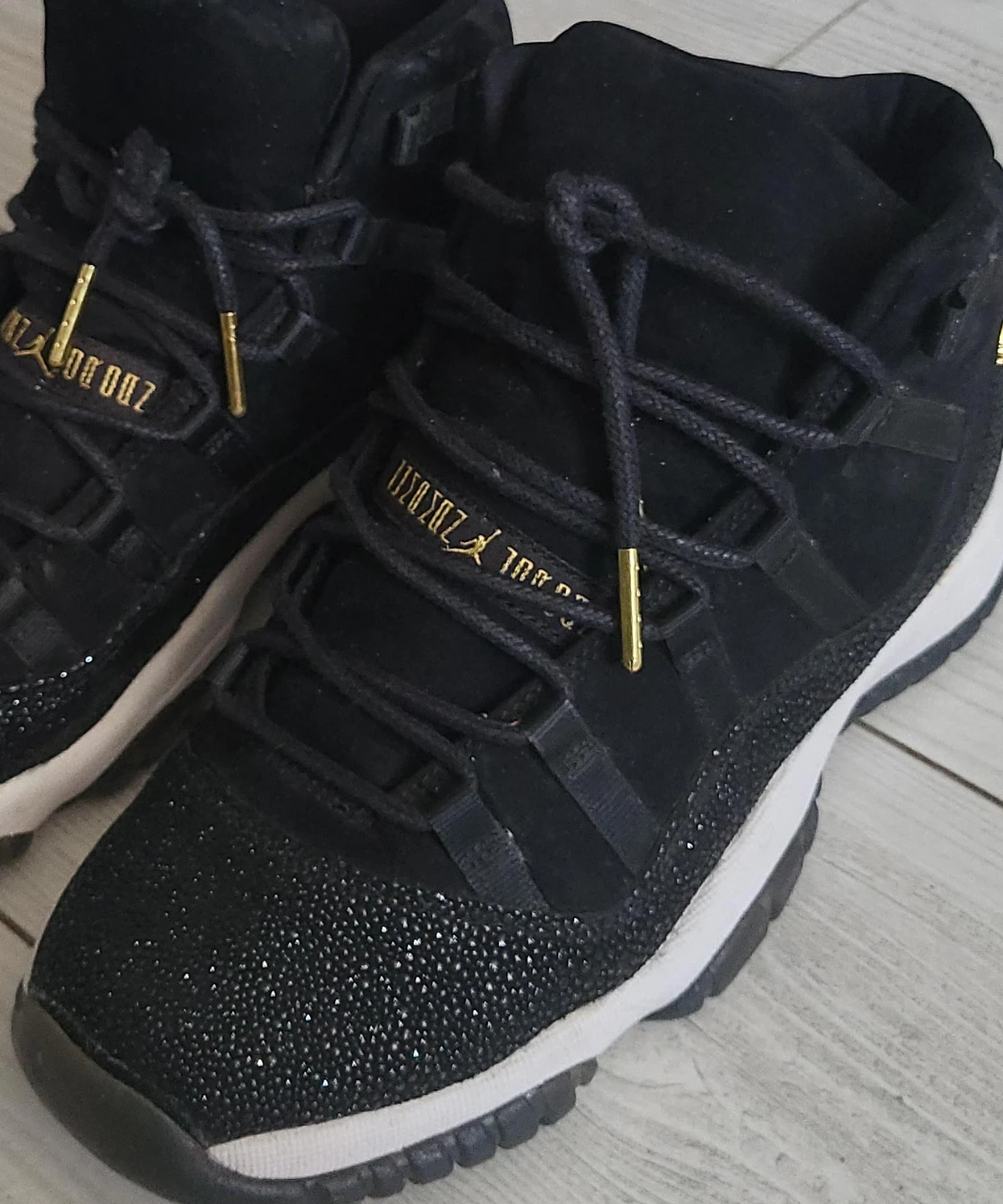 Air Jordan 11 Black Gold Sneakers