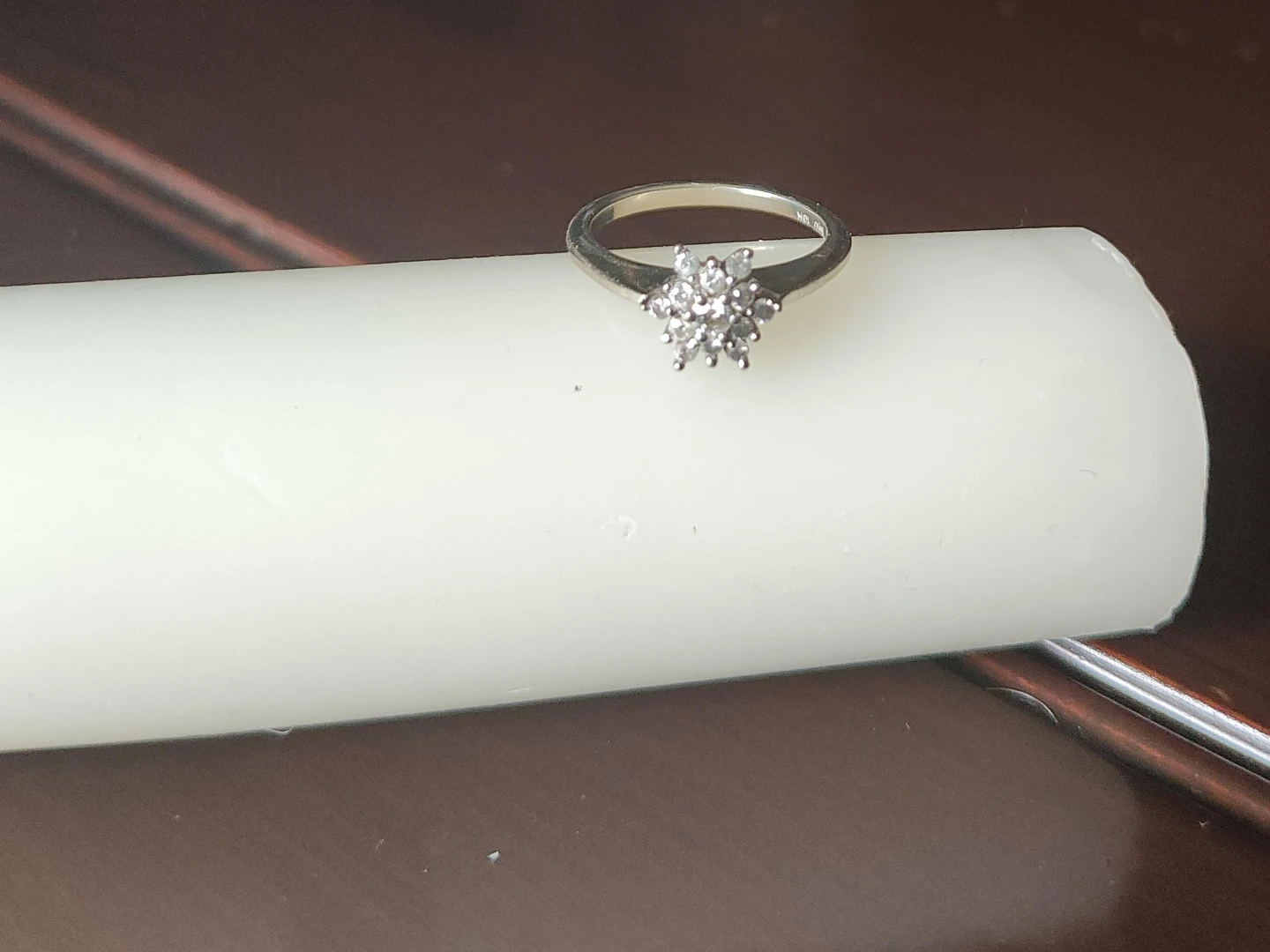 Silver-tone engagement ring with diamond cluster