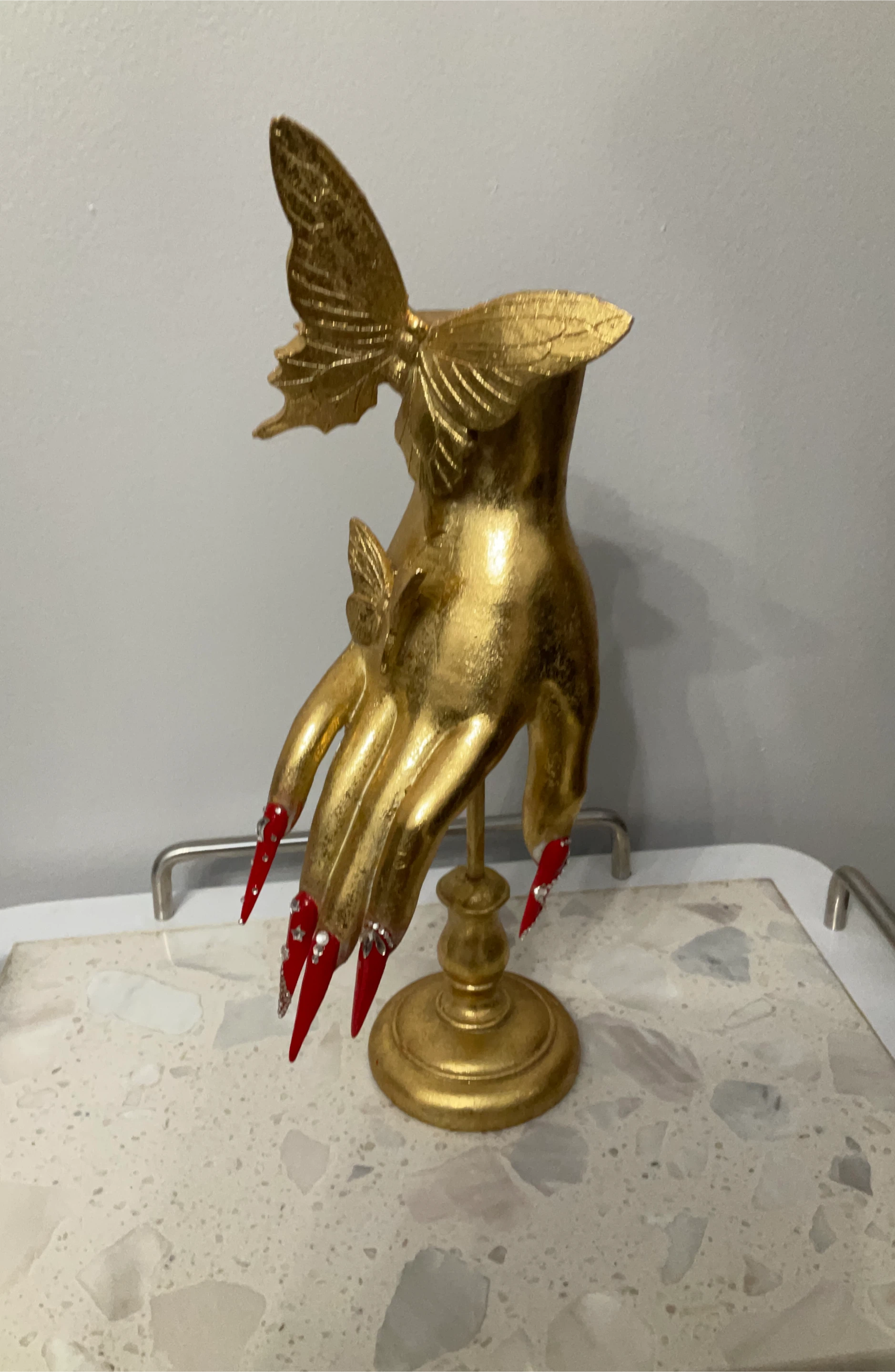 Gold Hand Figurine with Red Nails and Butterflies