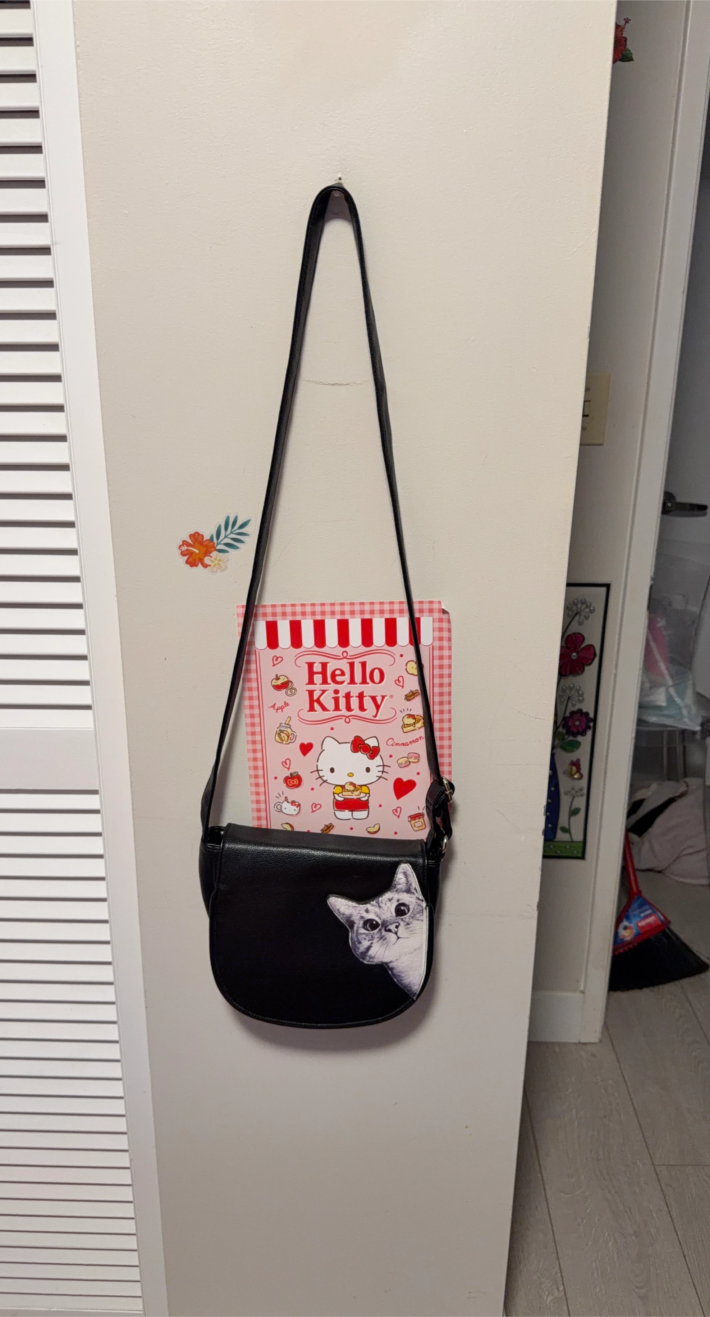 Black purse with a cute cat design