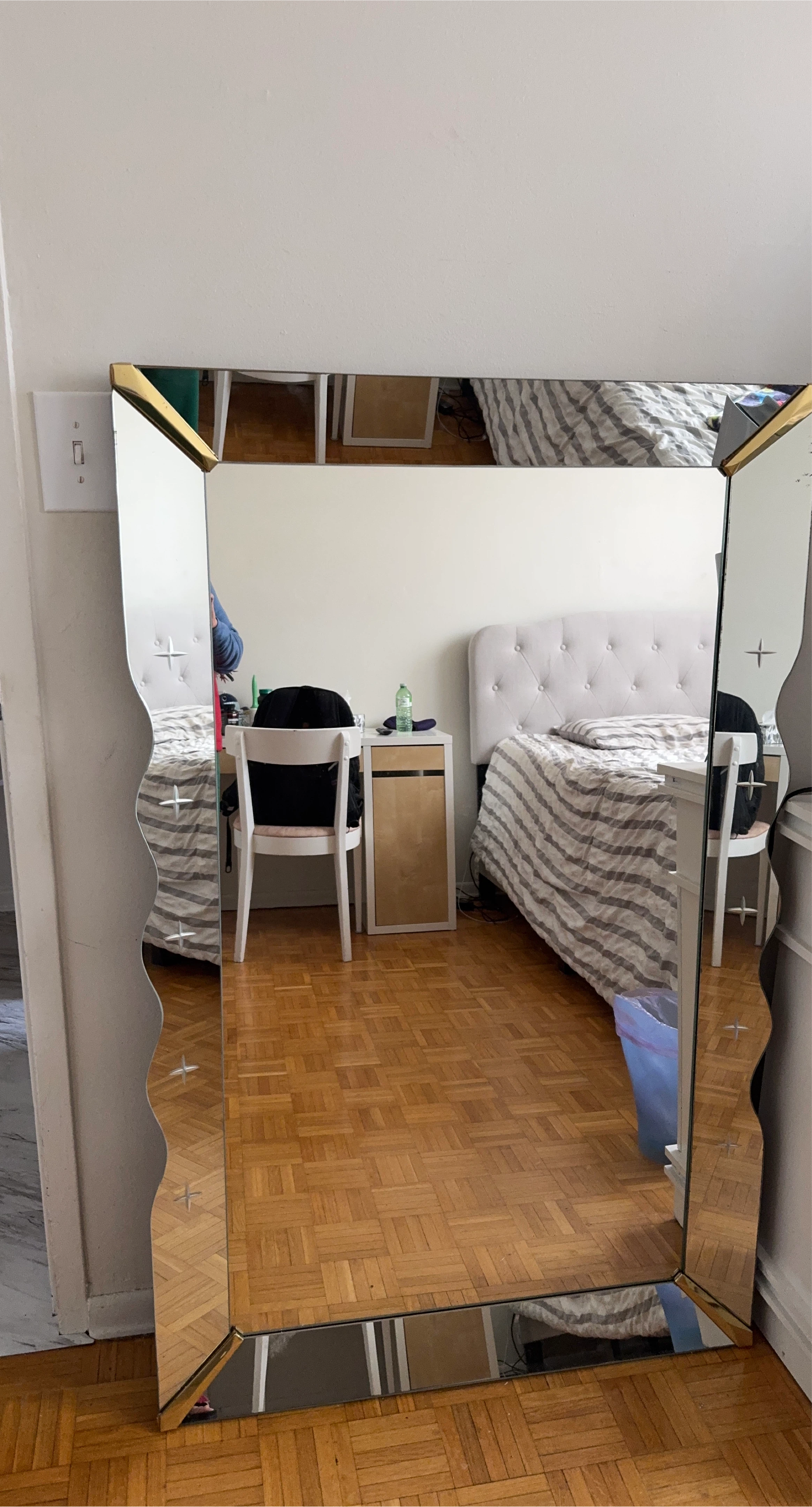 Large decorative mirror with gold accents