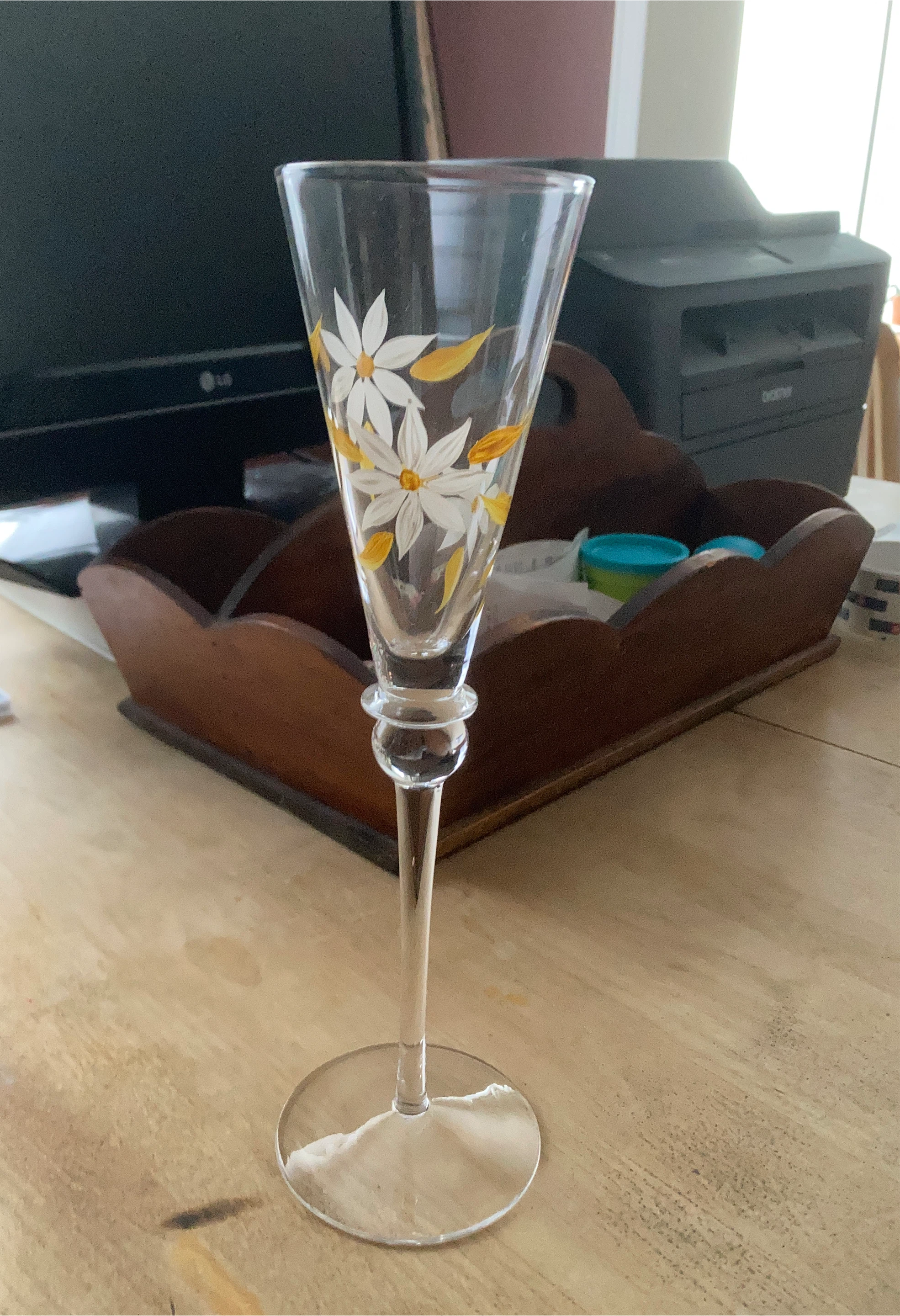 Glass champagne flute with painted daisies
