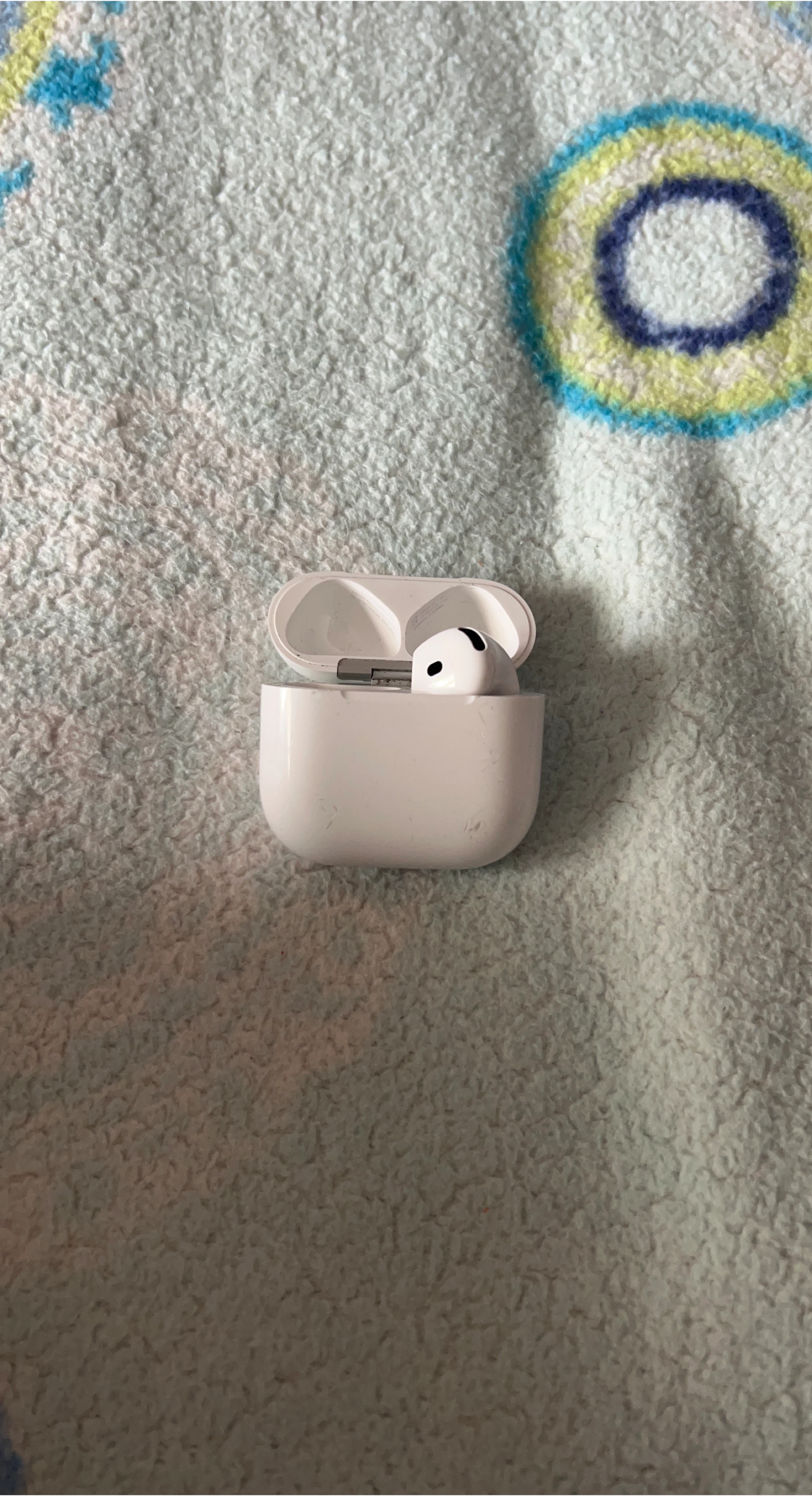 Apple AirPods (4th Gen) with Charging Case only right side.