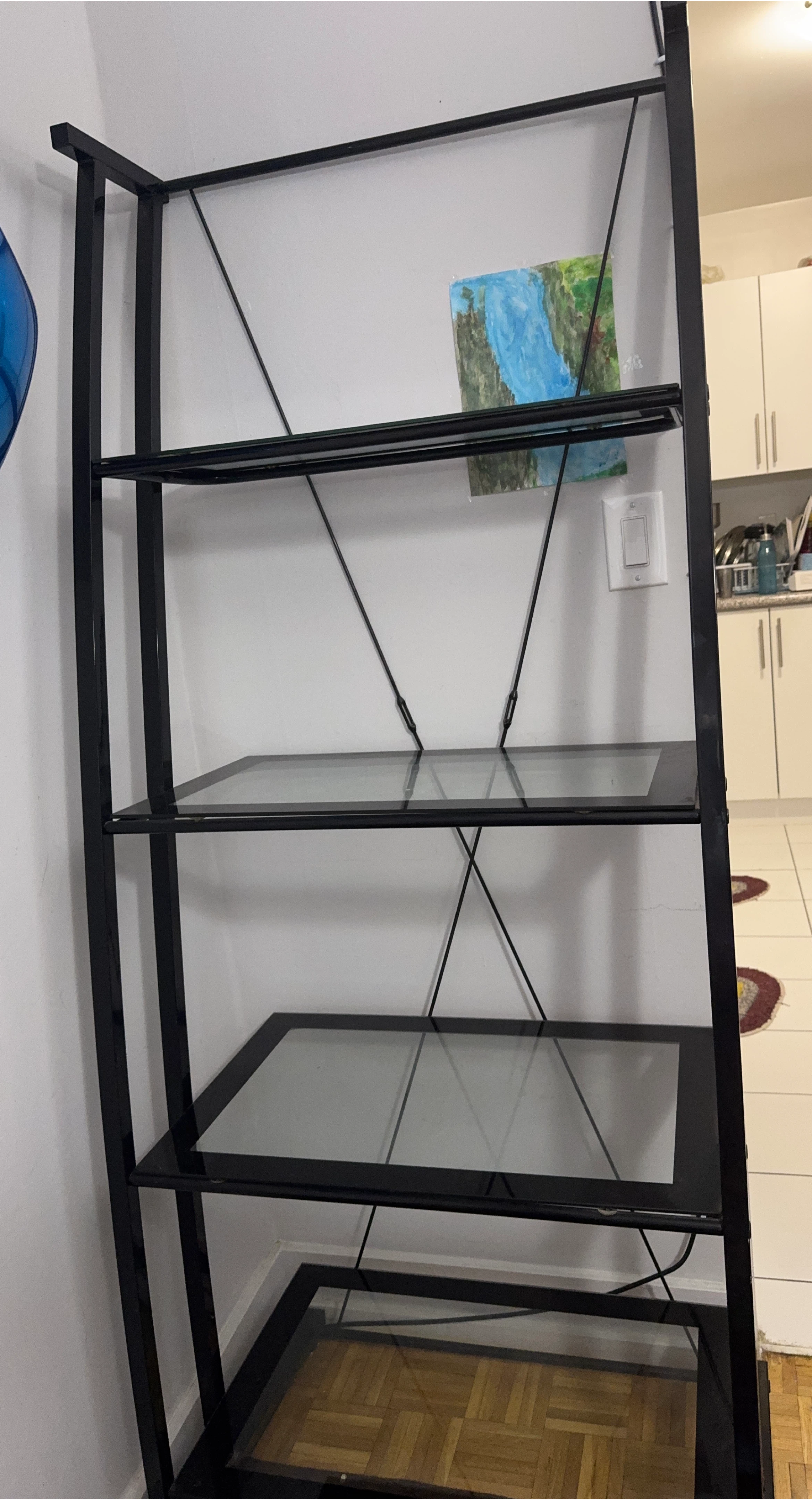 Black metal and glass shelving unit