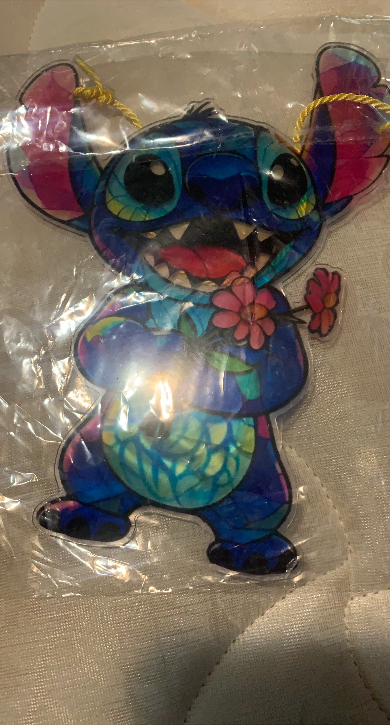 Stitch holding flowers it goes above your window