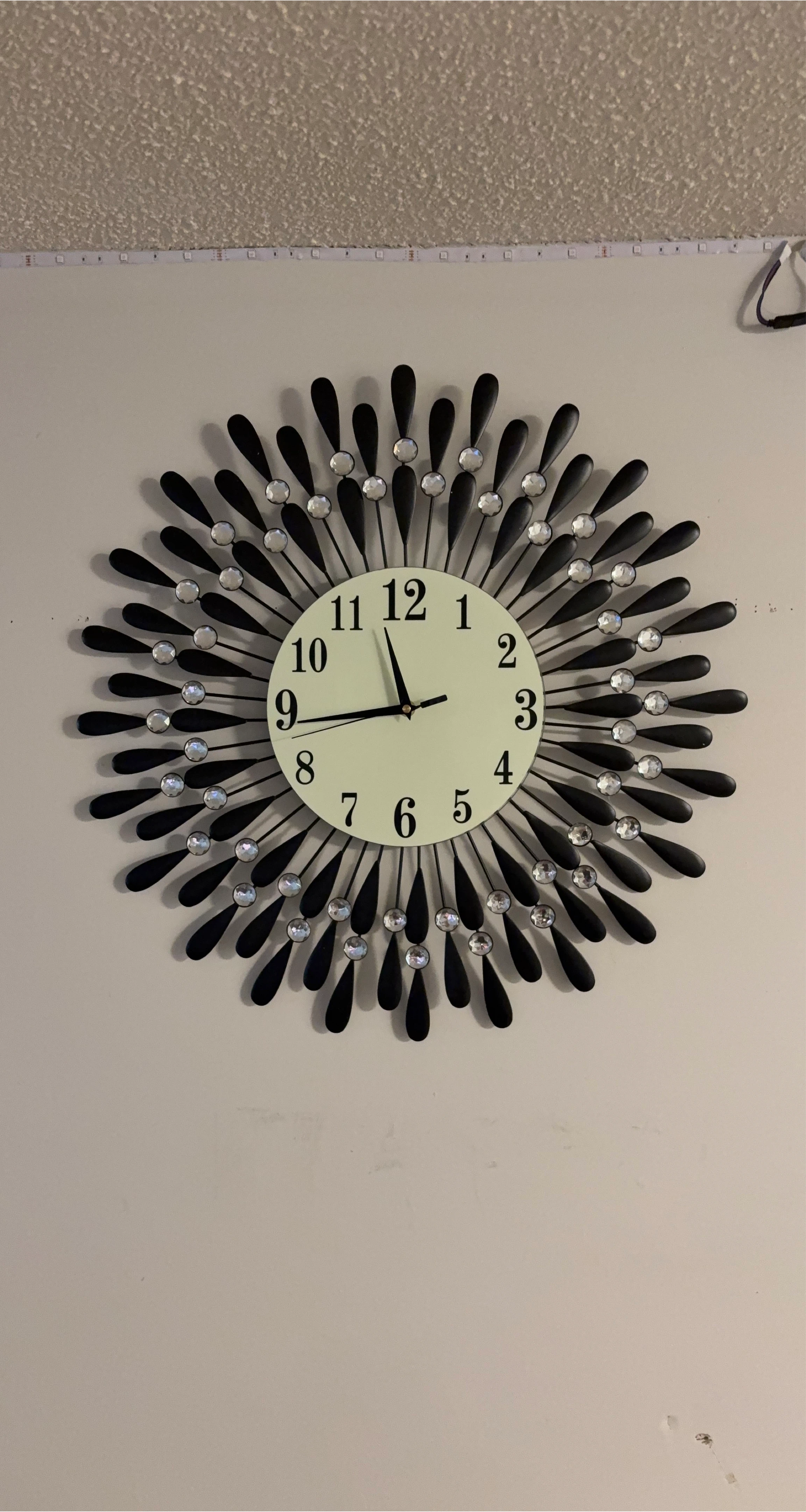 Black Sunburst Wall Clock with Rhinestones