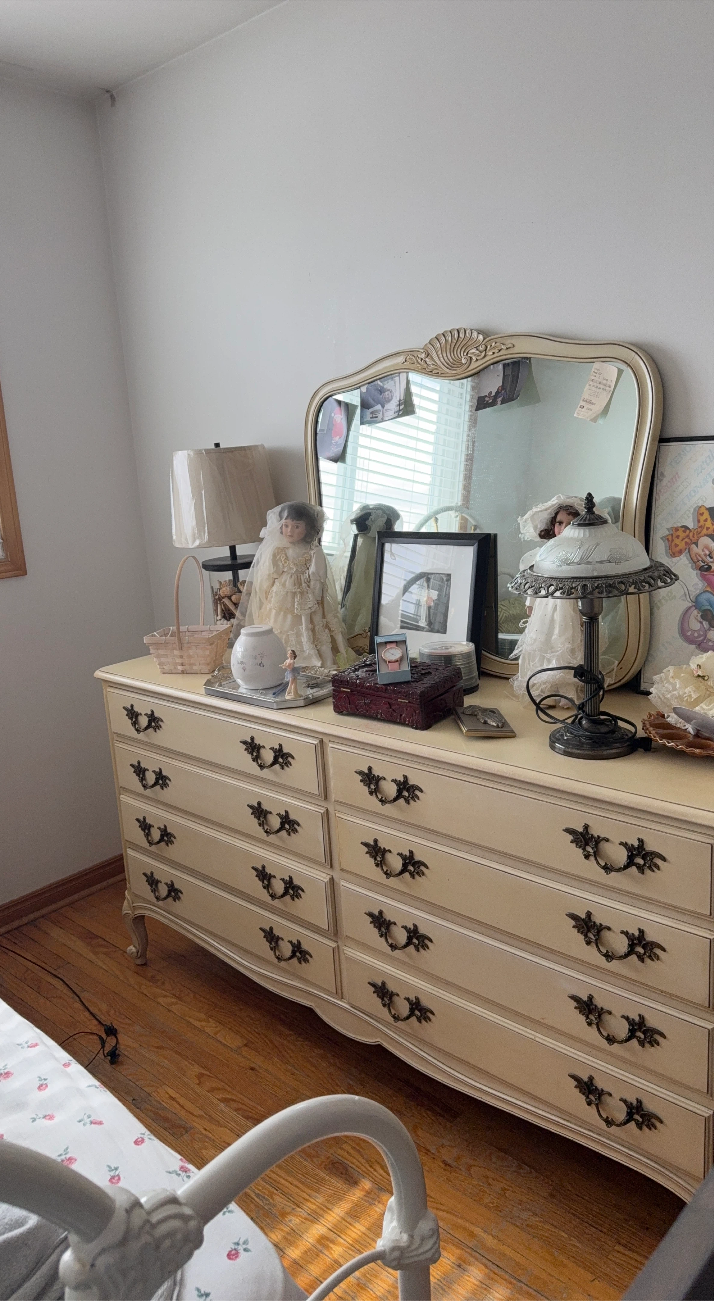 Cream coloured dresser with 8 drawers and ornate handles