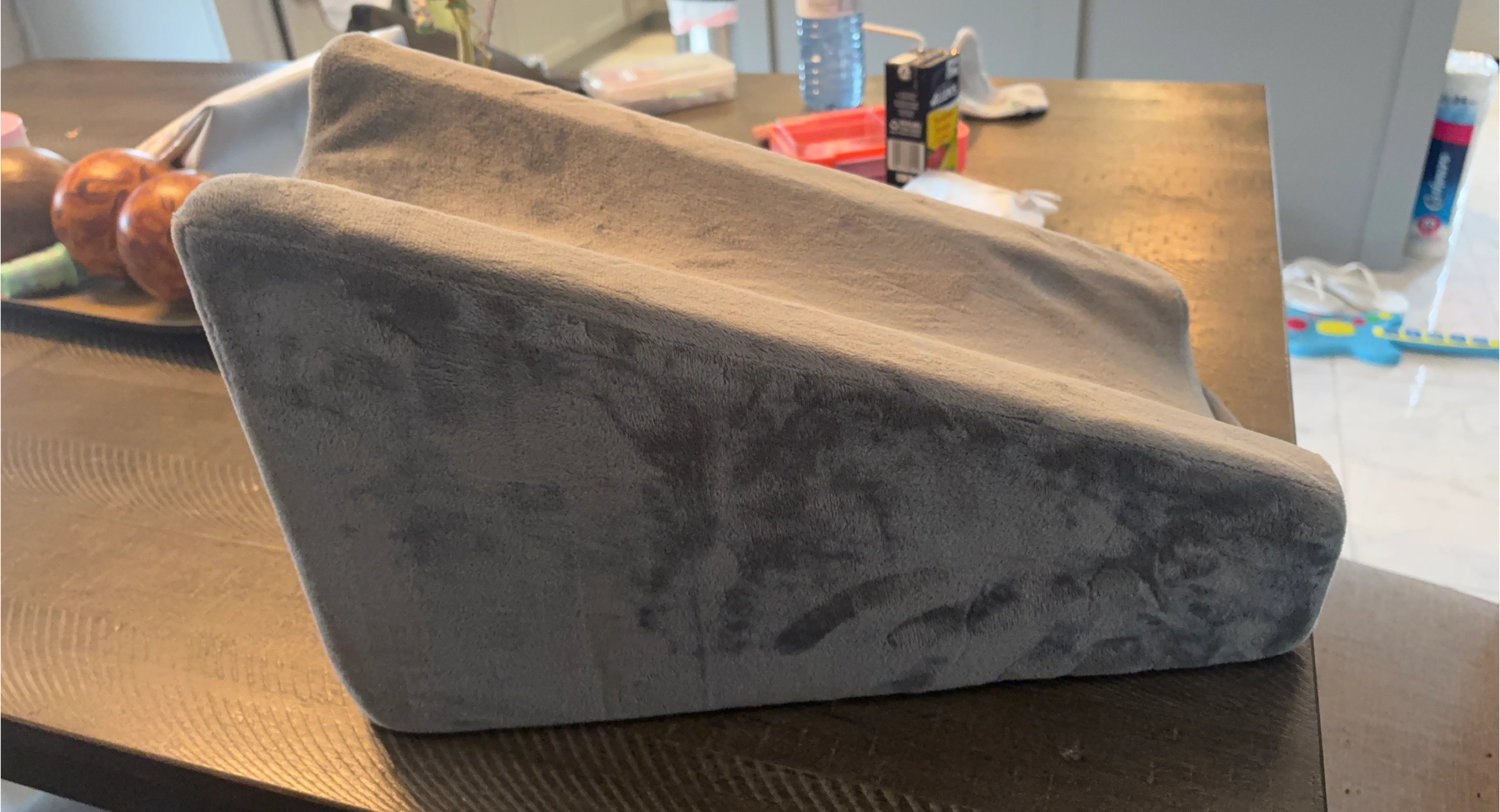 Grey Wedge Pillow used for arm or leg elevation