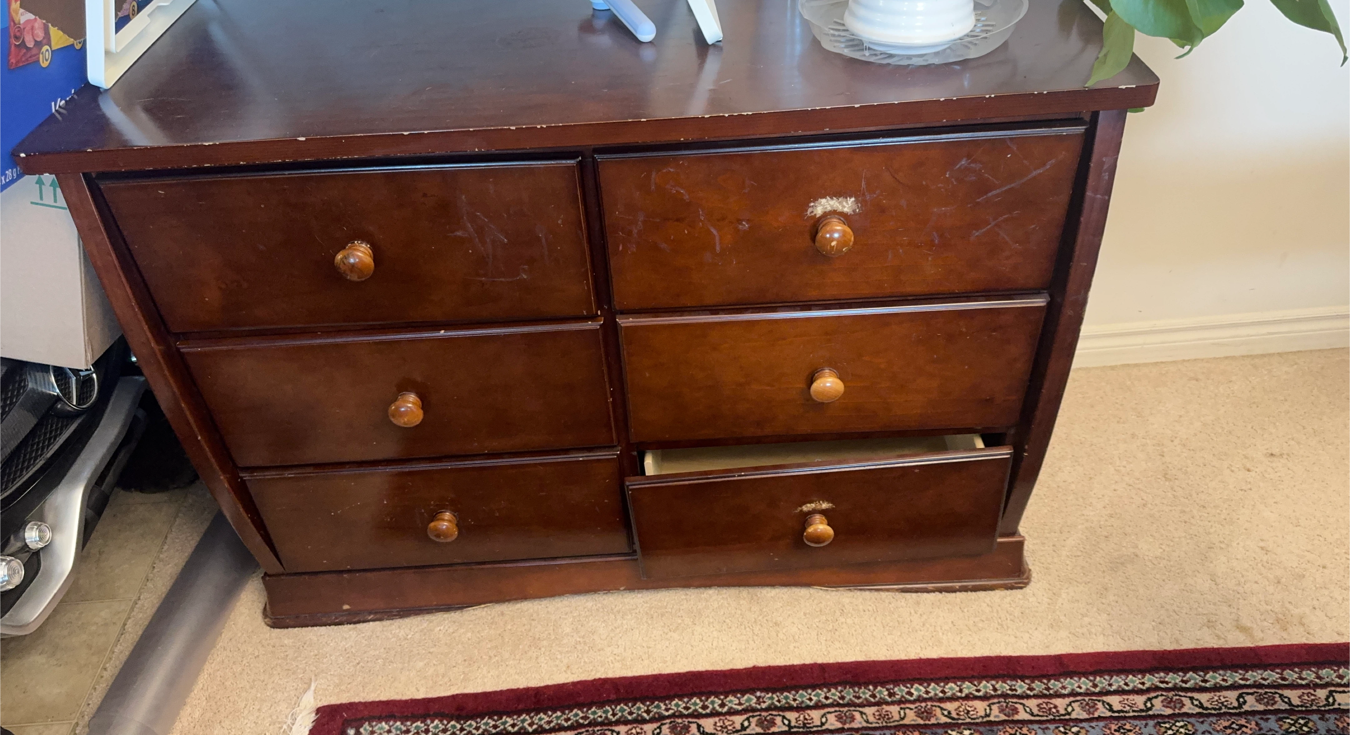 Dark wood dresser with six drawers