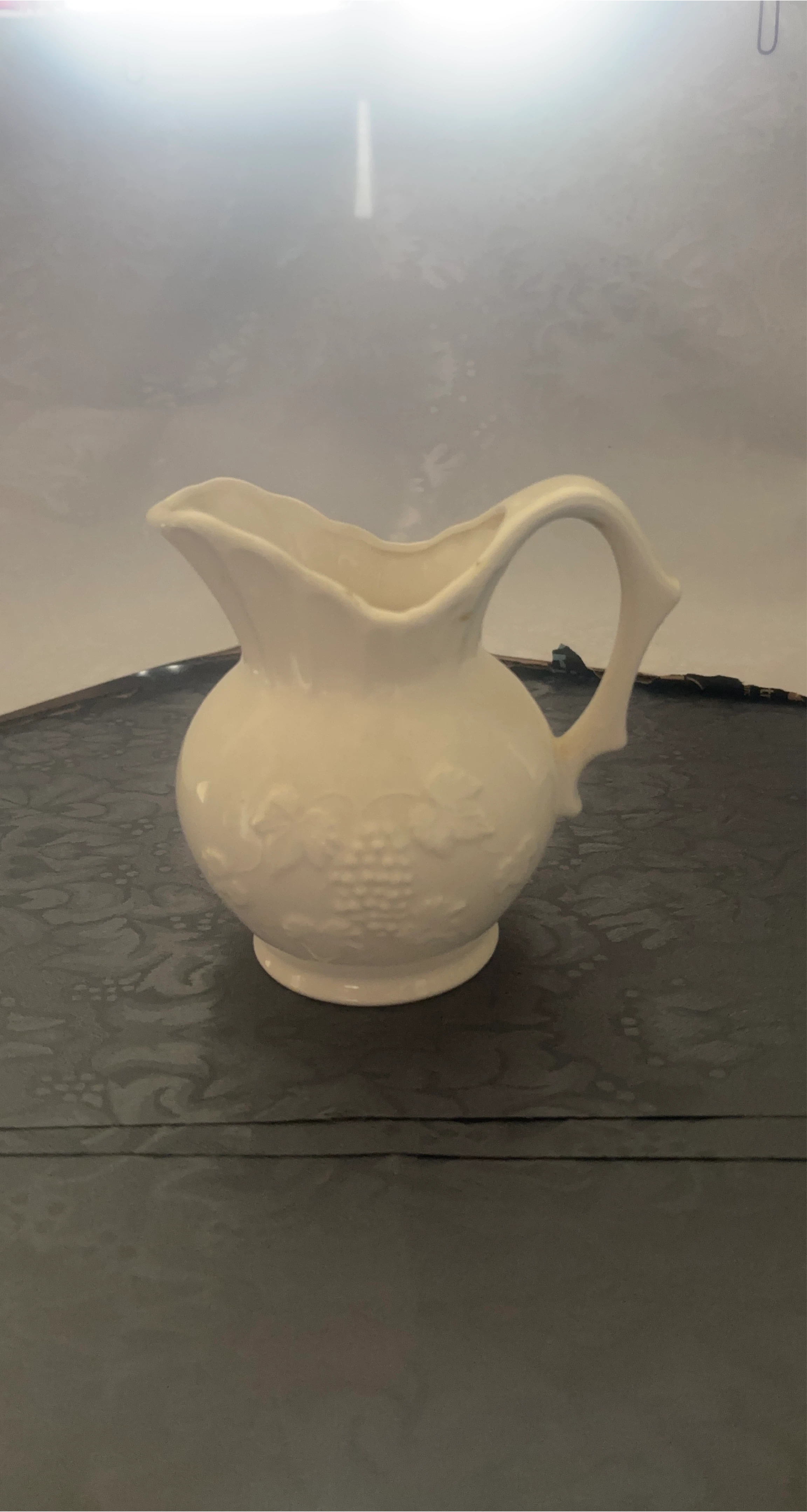 White Ceramic Pitcher with Embossed Grapevine Design