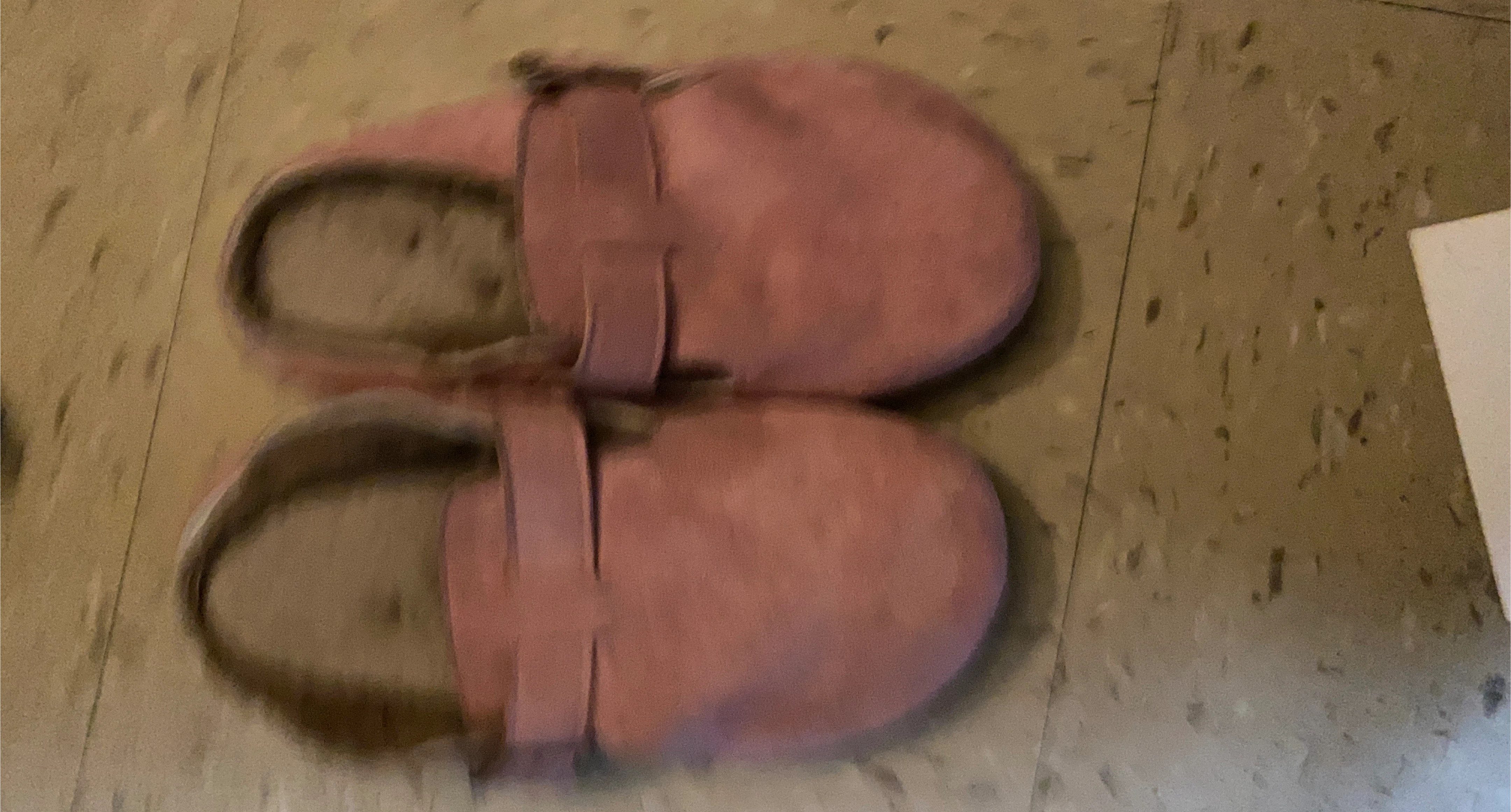 Pink fuzzy slippers