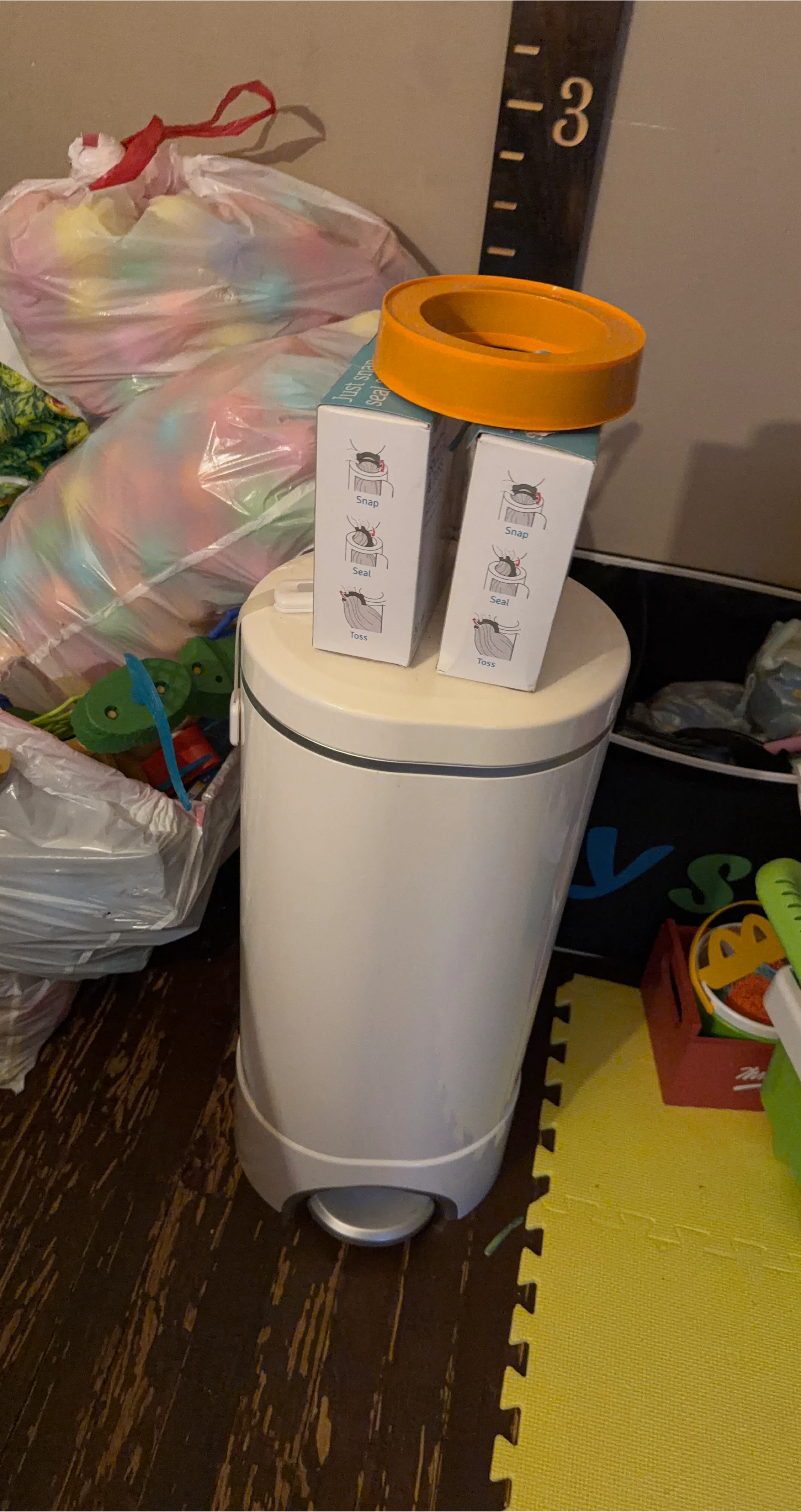 Litter Genie Diaper Pail with refill cartridges.