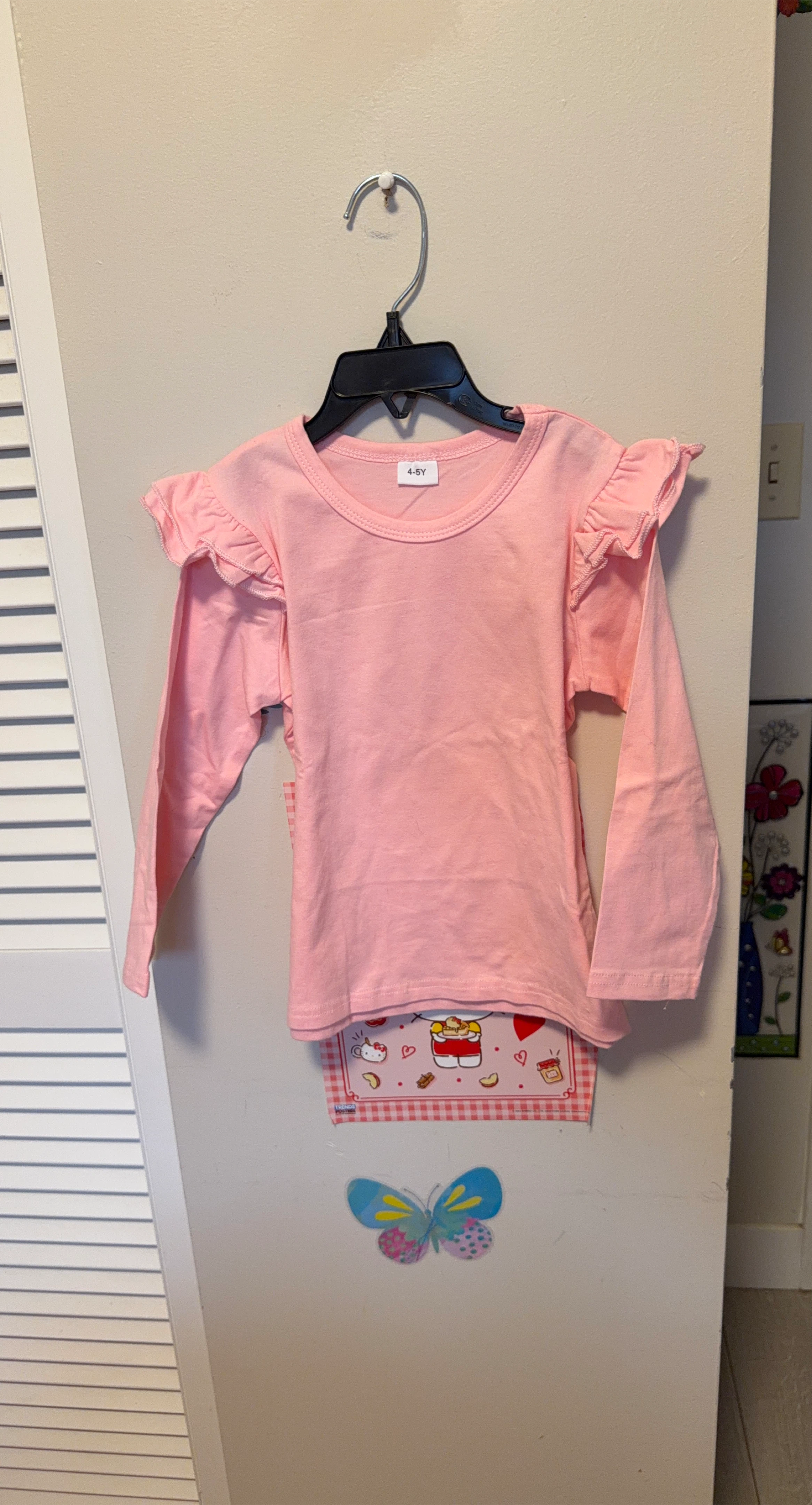Pink long-sleeve shirt with ruffles