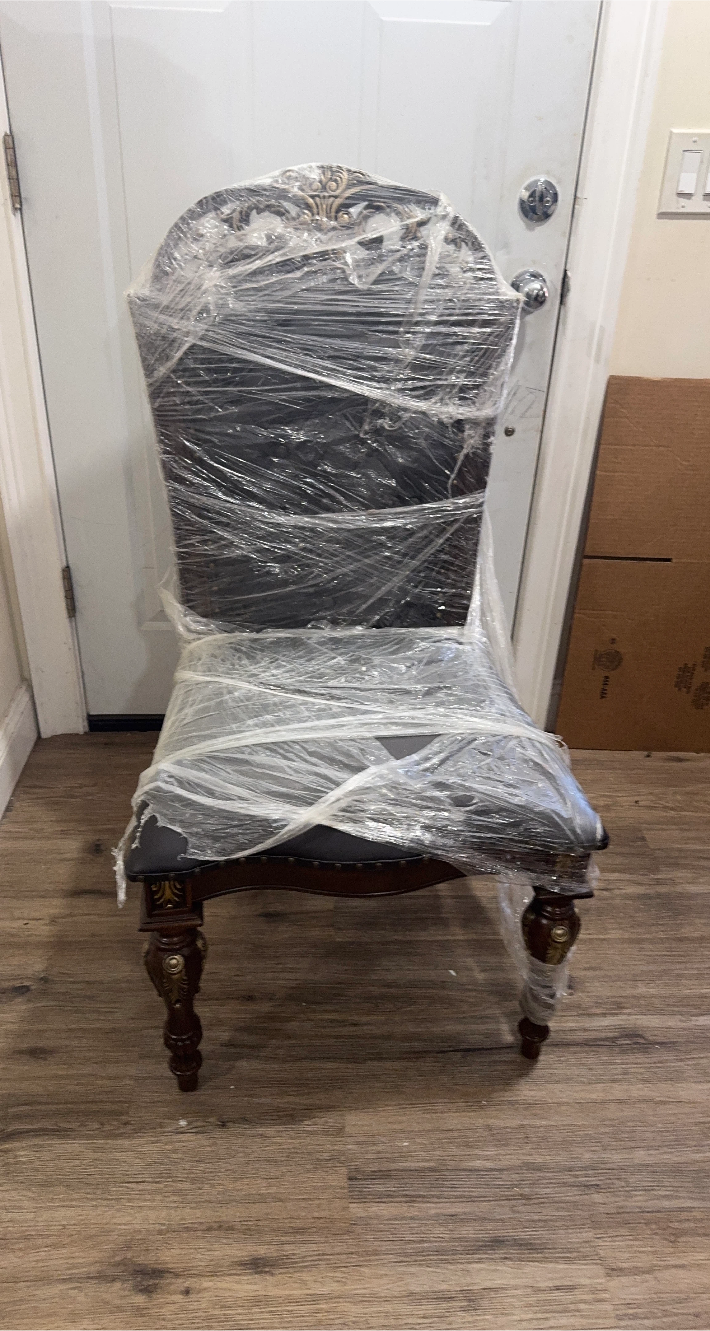 Ornate Dining Chair with Dark Upholstery