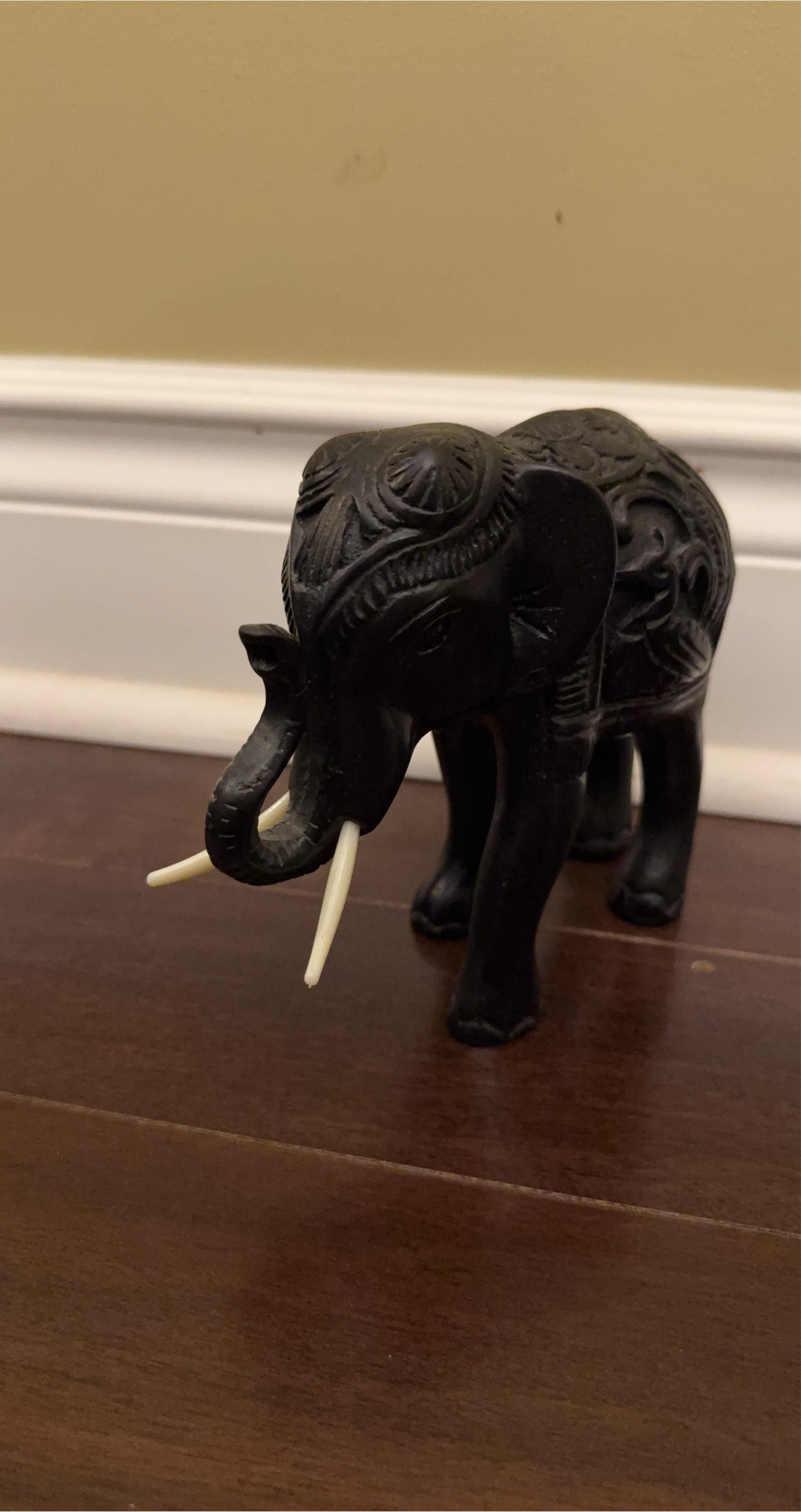 Carved Black Elephant Figurine with Tusk Accents