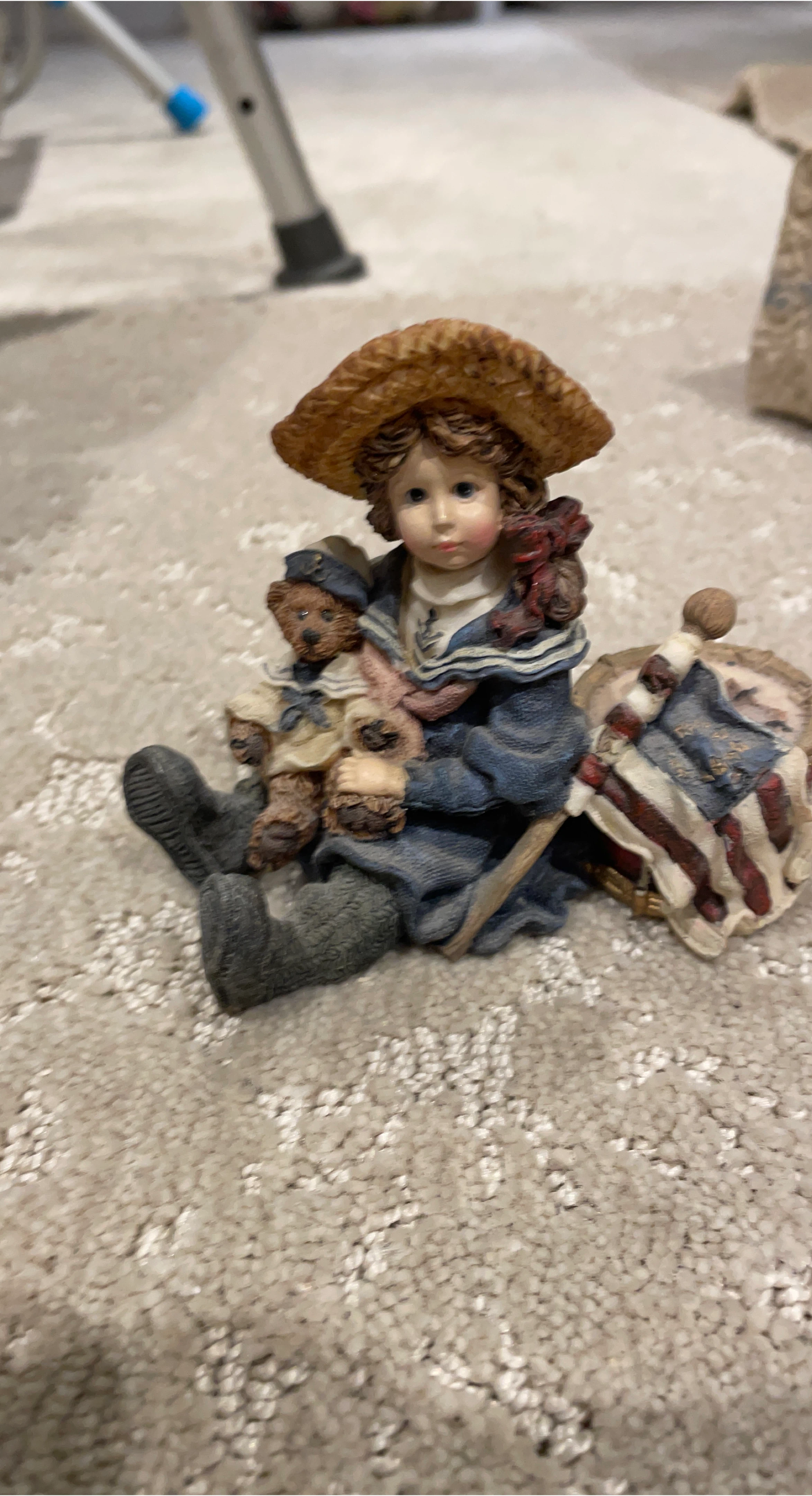 Figurine of a girl with teddy bears