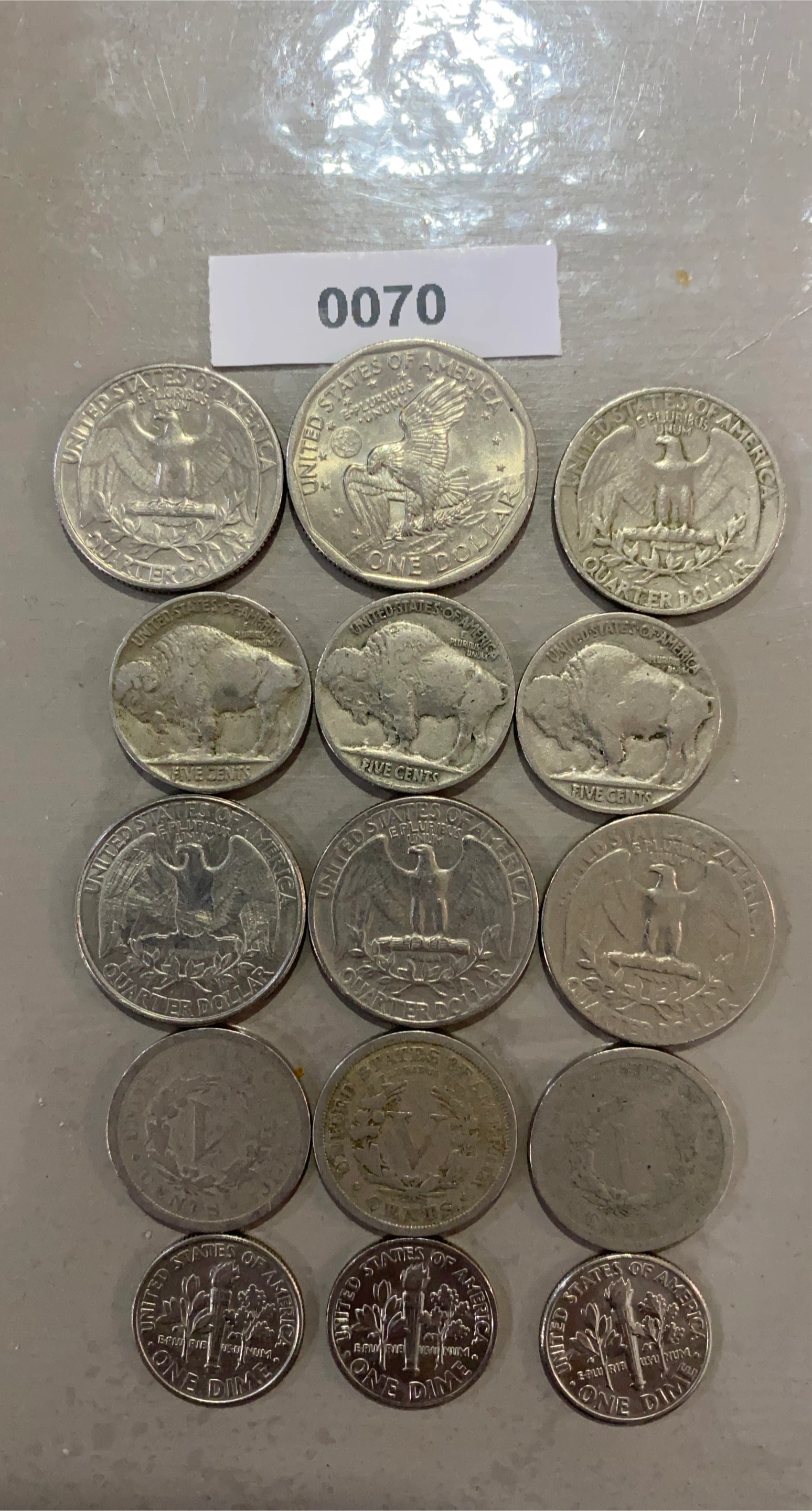 Assorted US Coins: Quarters, Nickels, Dimes, and Pennies