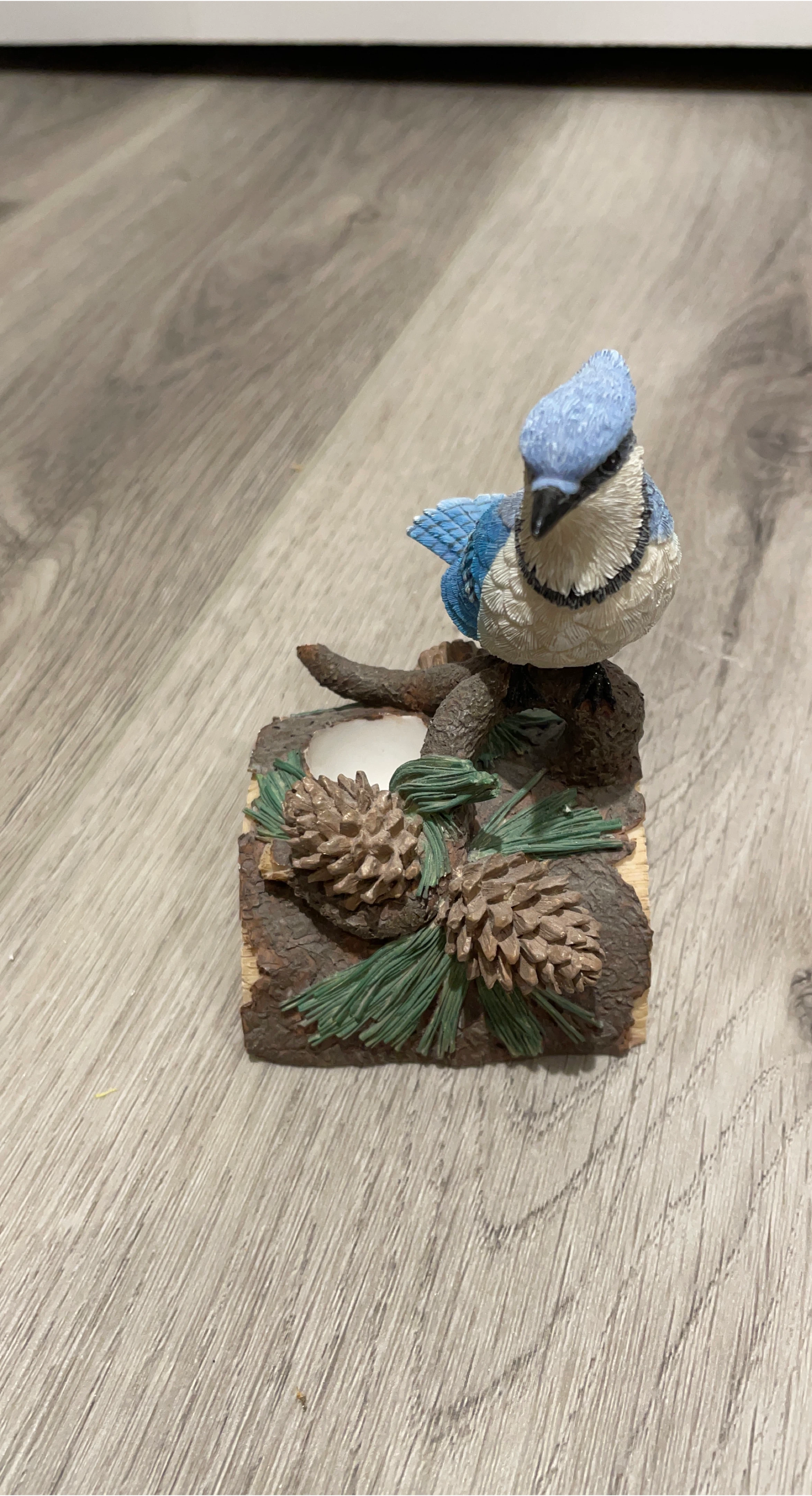 Blue Jay Figurine on Pine Branch