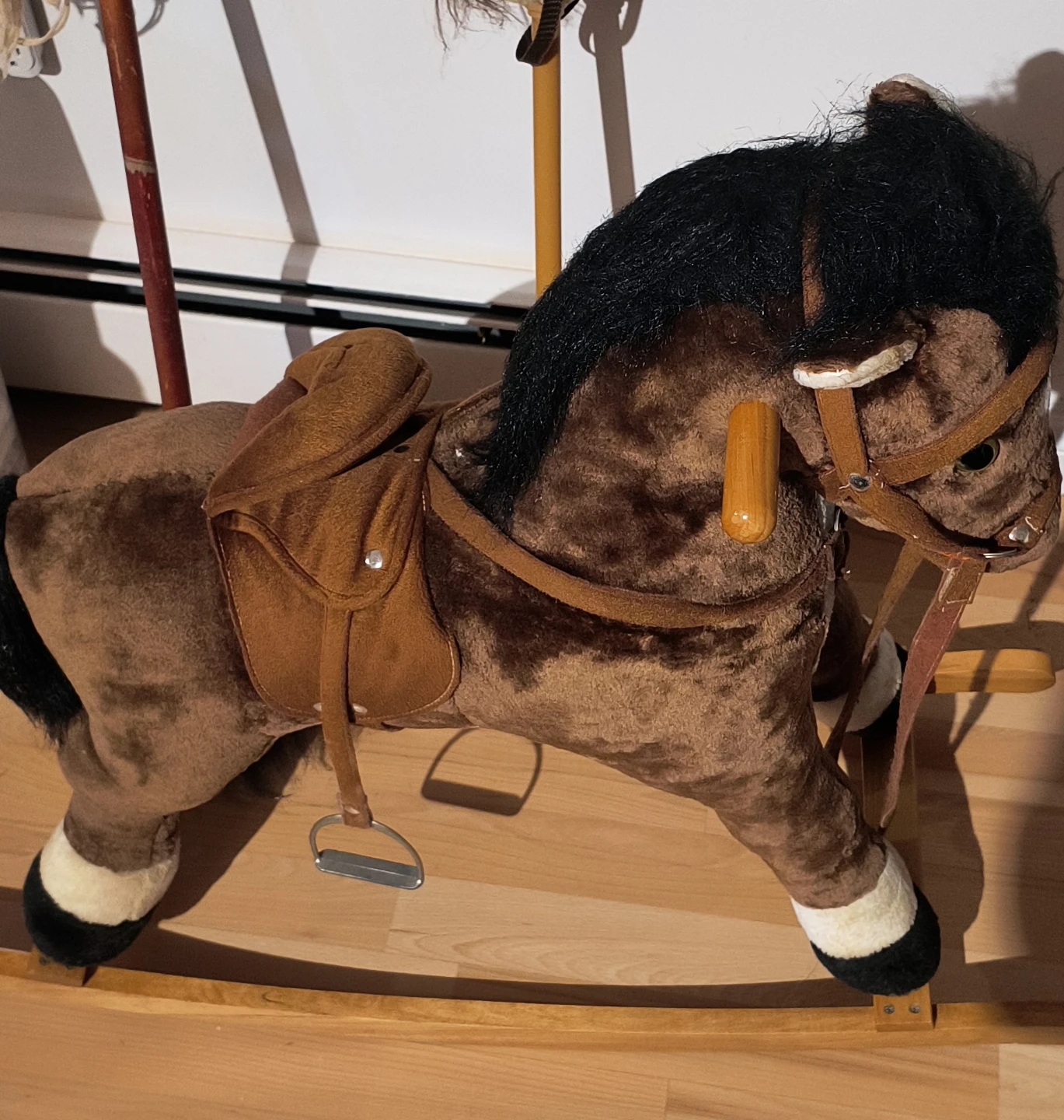 Brown Plush Rocking Horse / And two stick horse