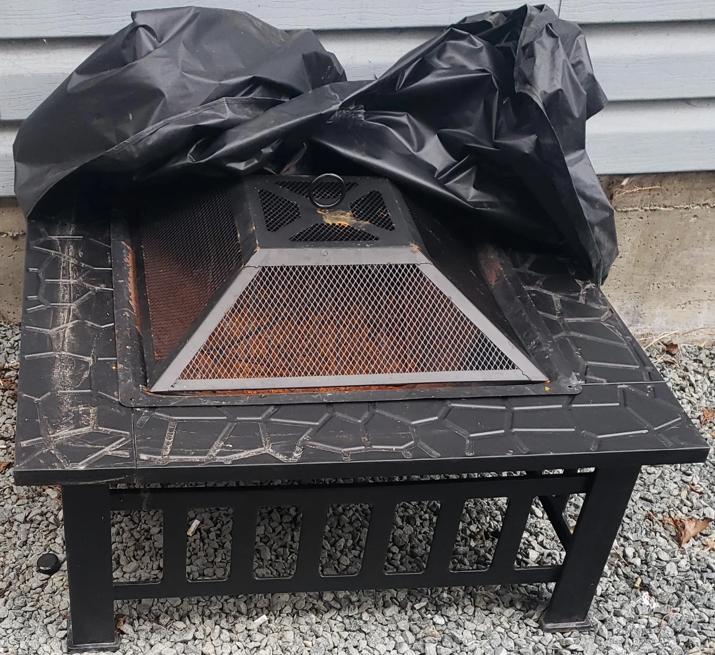 Black Outdoor Fire Pit with Stone Pattern