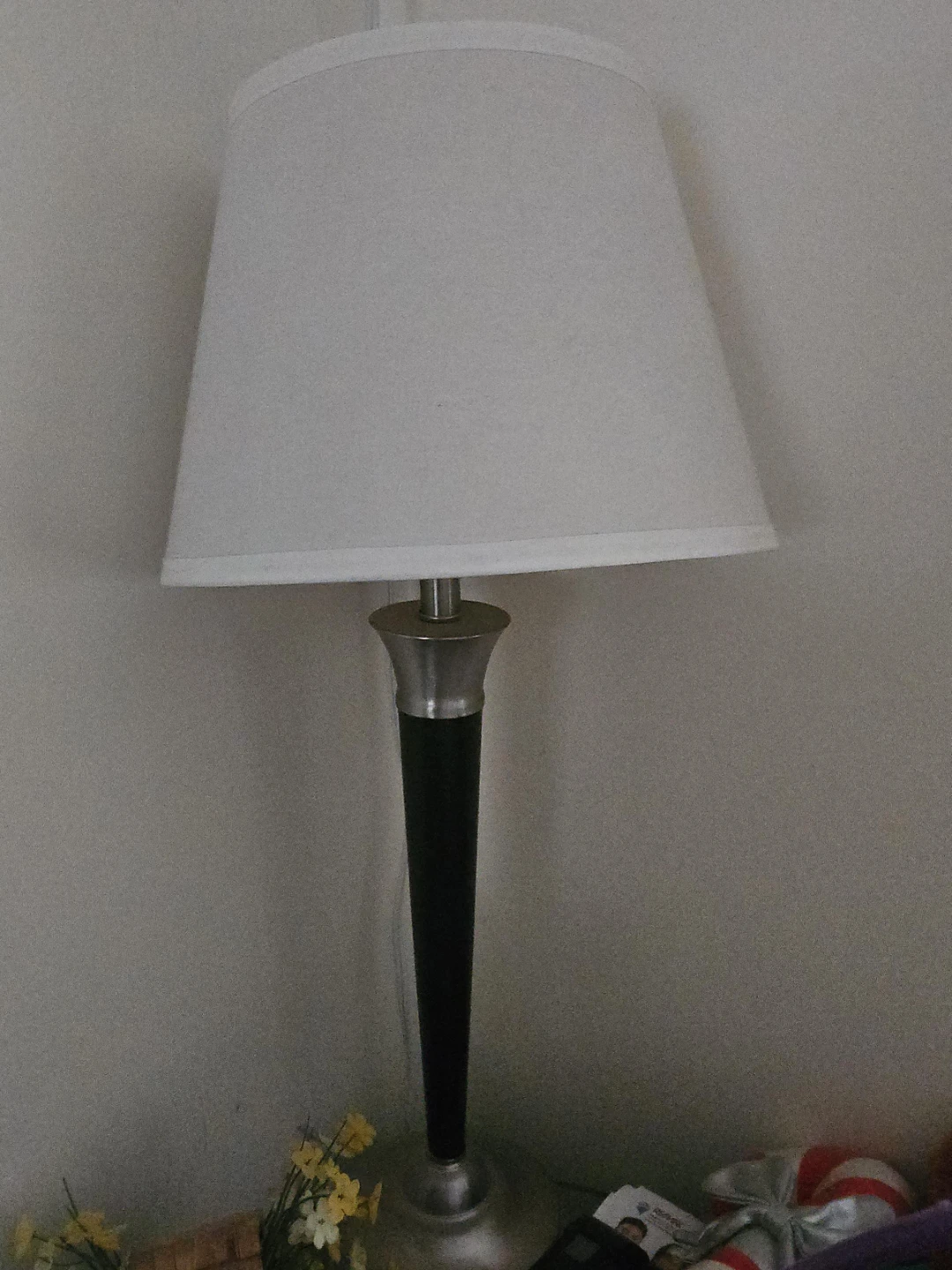 Silver and black table lamp with white shade