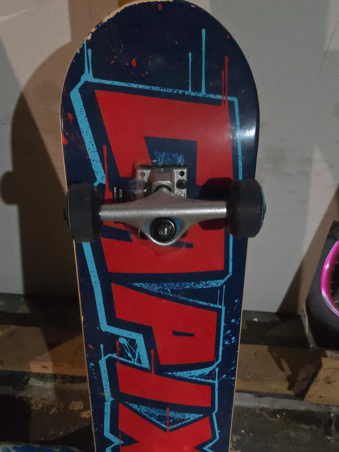 Skateboard with Red and Blue Design
