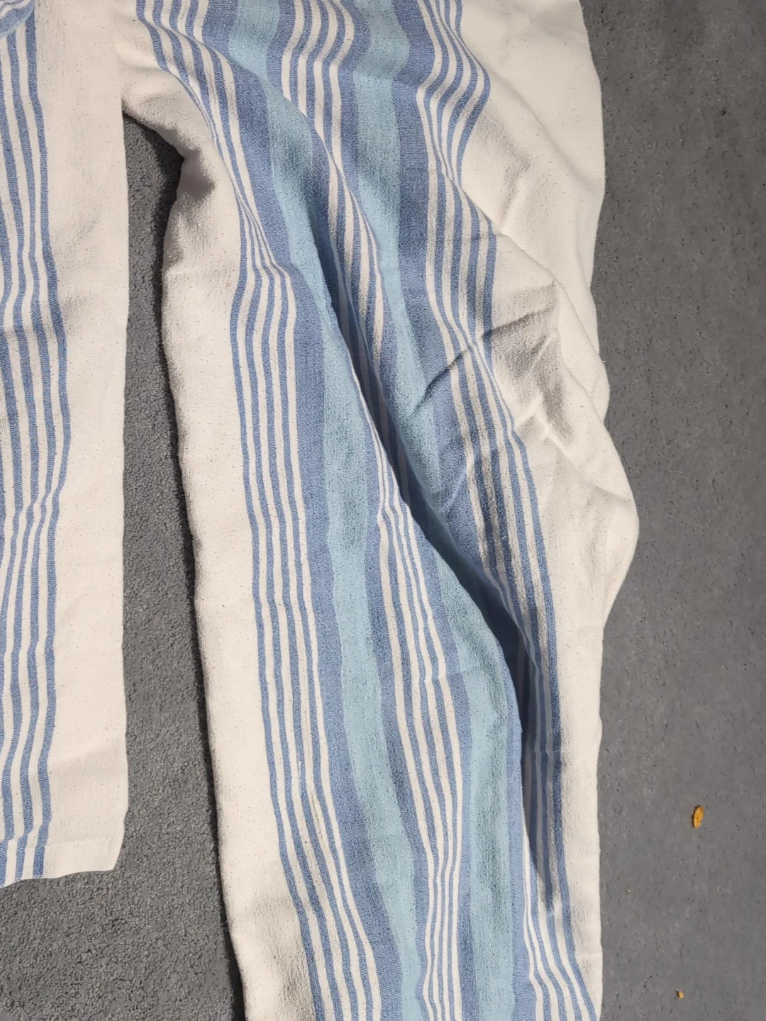 White and blue striped throw blanket