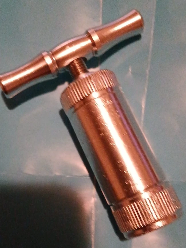 Metal pill crusher